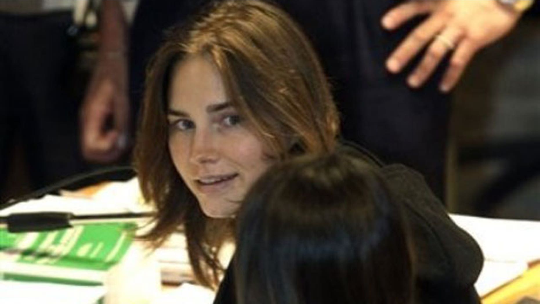 September 29: Amanda Knox looks on as she sits next to her lawyer Maria Del Grosso at the Perugia court, central Italy.
