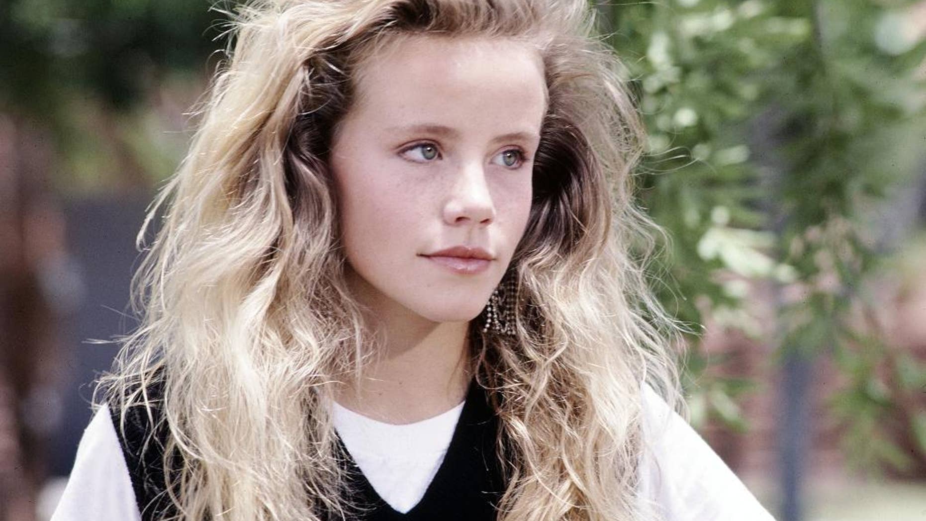 File-This undated file photo provided by Disney shows actress Amanda Peterson in "Can't Buy Me Love." The death of Peterson, best known for her role in the 1987 romantic comedy "Can't Buy Me Love," was the result of an accidental morphine overdose. The autopsy and toxicology report released Wednesday, Sept. 2, 2015, by the Weld County Coroner's Office concluded that Peterson, 43, ingested a friend's morphine medication for unspecified pain a week before her death. (Copyright Disney via AP, File)