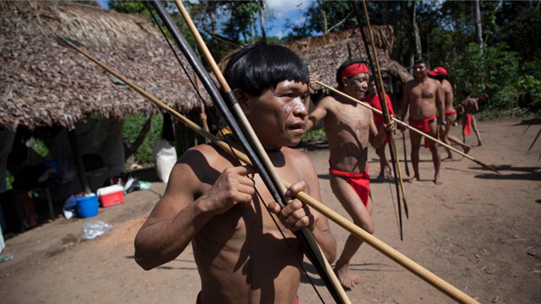 FILE -In this Sept. 7, 2012 file photo, Yanomami Indians dance in their village called Irotatheri in Venezuela's Amazon region. In a remote part of the Venezuelan Amazon, scientists have discovered that members of a village isolated from the modern world have the most diverse colonies of bacteria ever reported living in and on the human body. The microbiome _ the trillions of mostly beneficial bacteria that share our bodies _ plays a critical role in maintaining health. Friday's study raises tantalizing questions about the microbial diversity of our ancestors, and whether todays Western diets and lifestyles strip us of some bugs we might want back. (AP Photo/Ariana Cubillos, File)