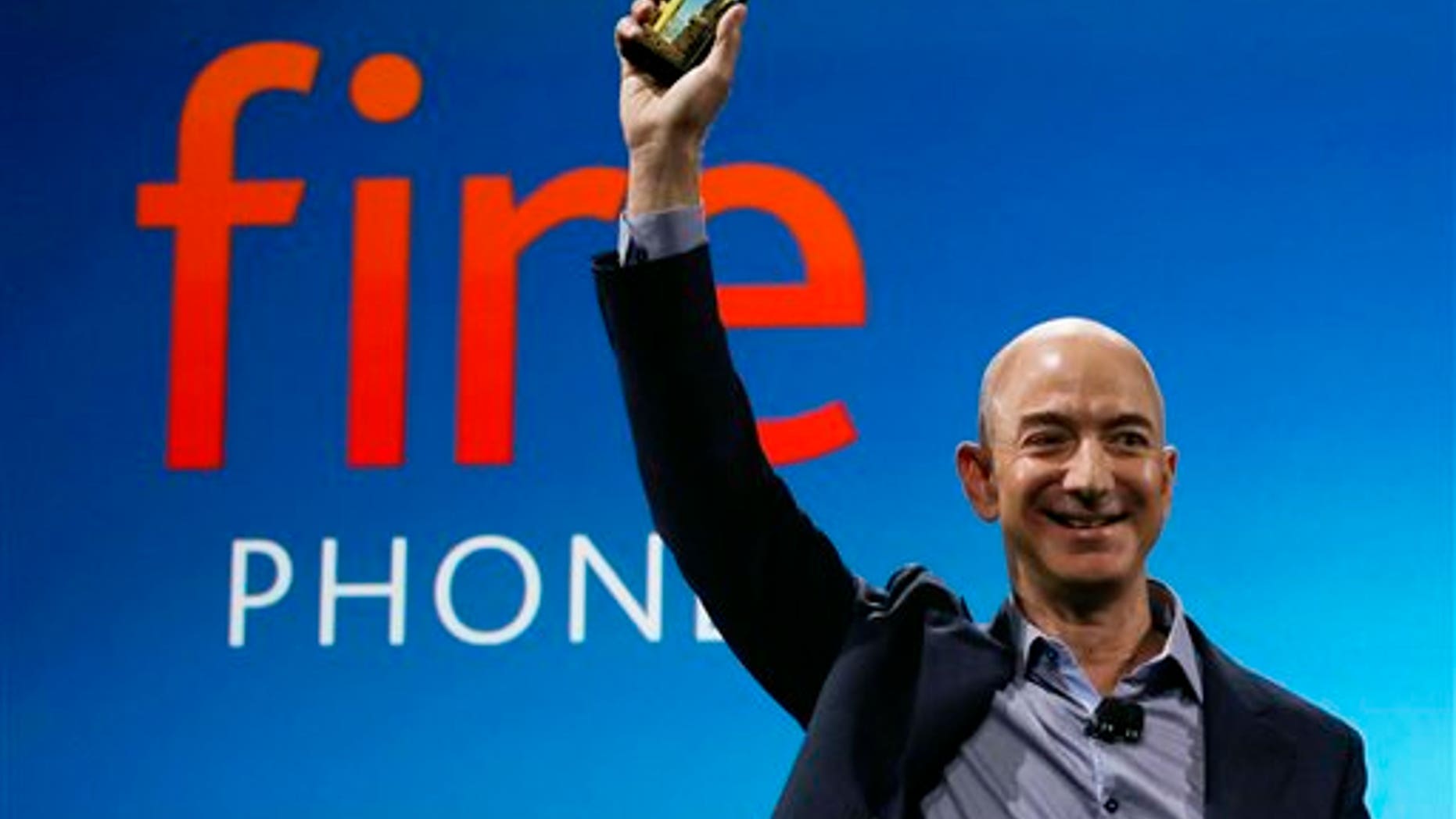 Amazon CEO Jeff Bezos introduces the new Amazon Fire Phone, Wednesday, June 18, 2014, in Seattle. (AP Photo/Ted S. Warren)