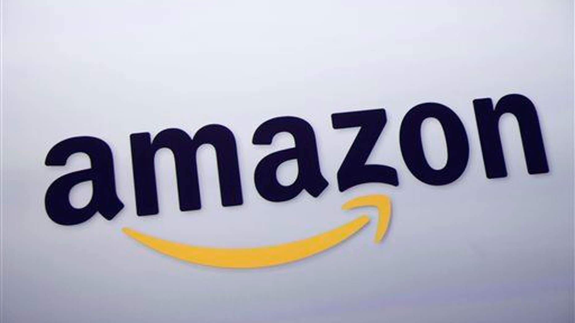 The Amazon.com logo is displayed at a news conference in New York.