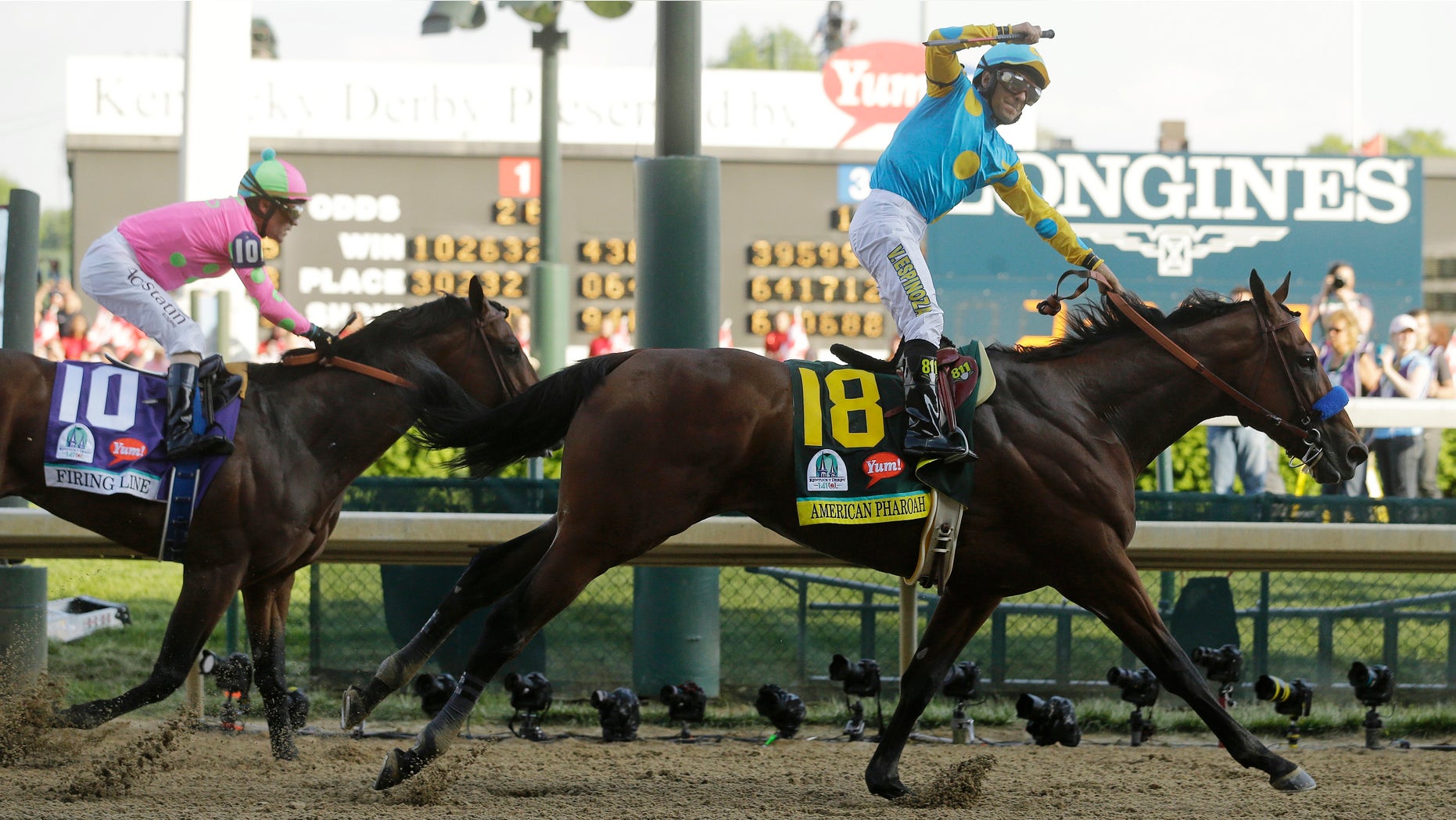 Victor Espinoza rides American Pharoah to victory in the 141st running of the Kentucky Derby horse race at Churchill Downs Saturday, May 2, 2015, in Louisville, Ky. (AP Photo/Morry Gash)