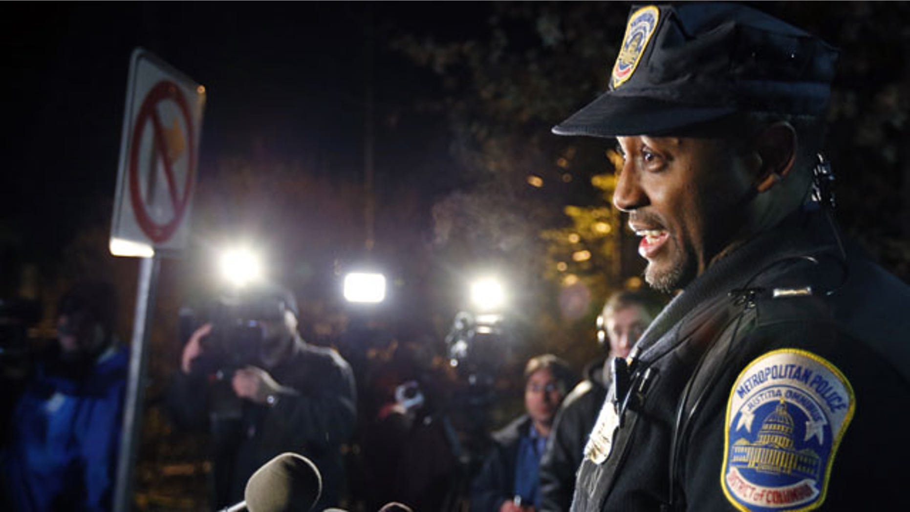 December 11, 2013: Washington Metro Police Lt. Jesse Porter speaks to the media outside American University in Washington. At the news conference after the lockdown had been lifted, Porter said the lockdown order was given after a student reported seeing a man with a holster on the shuttle. Porter said police have not confirmed that there was a weapon inside the holster. Police identified the man and determined that he was an off-duty police officer. (AP Photo/Alex Brandon)