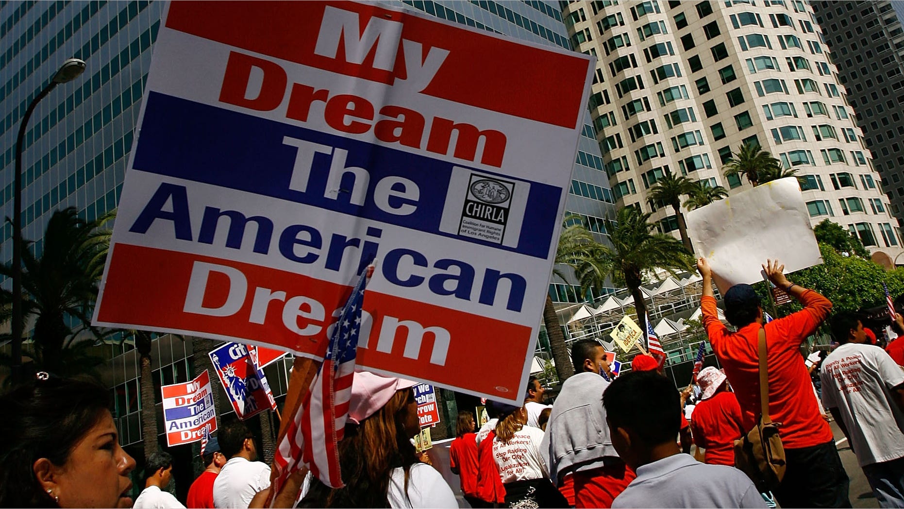 LOS ANGELES, CA - MAY 01: Demonstrators from three separate immigrants' rights marches converge for a massive May Day rally on May 1, 2008 in Los Angeles, California. Thousands are expected to turn out for the International Workers Day immigration-rights marches and rally. In 2007, some people threw their water bottles at police. Riot police reacted by forcing thousands of people from Macarthur Park, beating and shooting rubber bullets at marchers and journalists. The LAPD has been briefing their officers to prevent a replay of the so-called "May Day Malay". (Photo by David McNew/Getty Images)