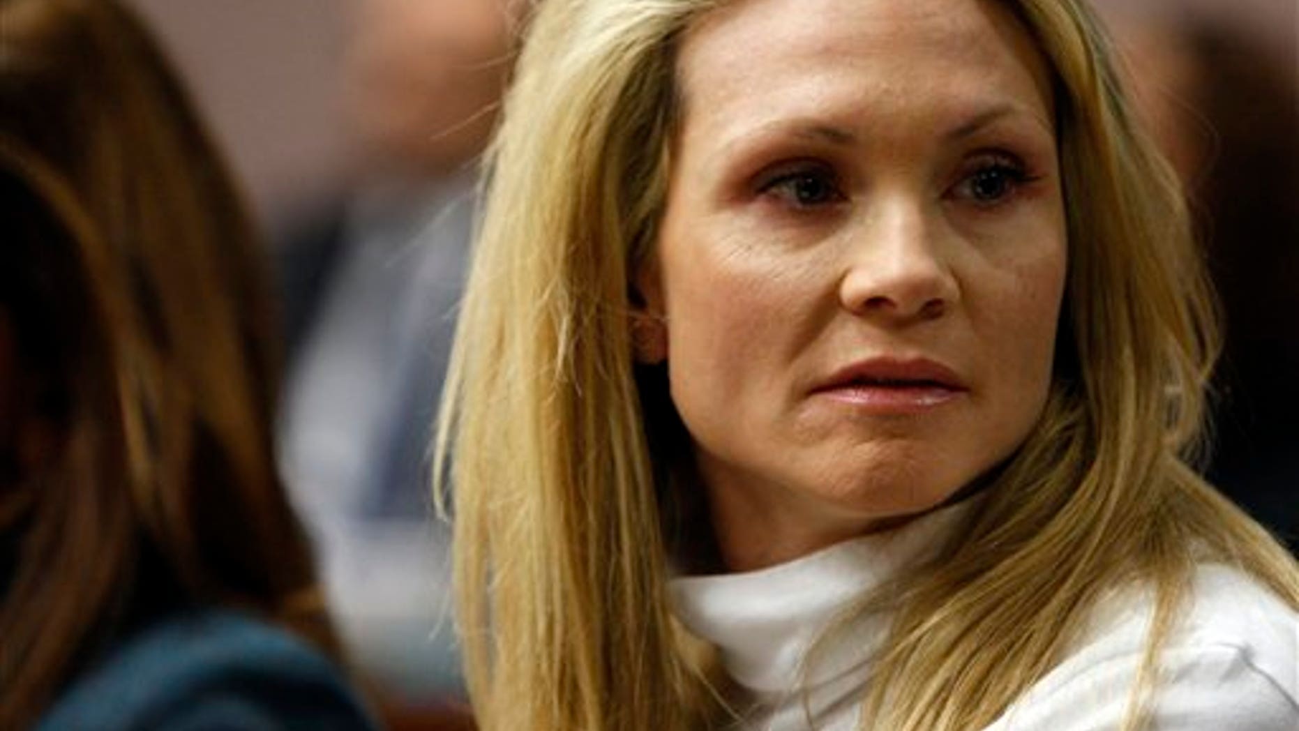 This Nov. 27, 2012 file photo shows former "Melrose Place" actress Amy Locane-Bovenizer in court as the jury in her trial returns a verdict in Somerville, N.J.