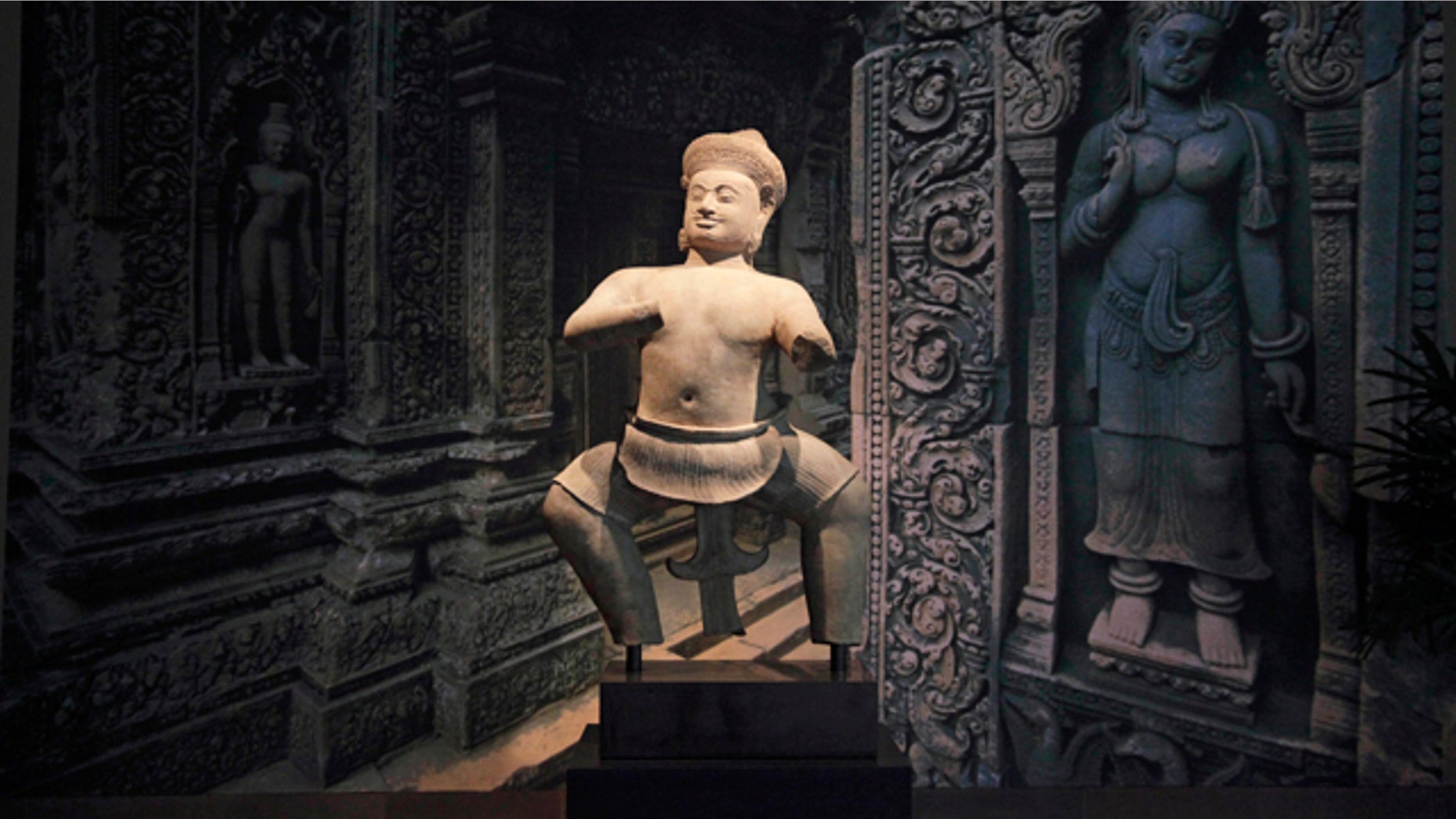December 18, 2013: This file photo shows Cambodia's statue of a temple wrestler, titled Bhima, on display at the Norton Simon Museum in Pasadena, Calif. The 10th-century sandstone statue will return to its place of origin in Cambodia following discussions and agreements with Cambodian state officials, the museum announced Tuesday. (AP Photo/Jae C. Hong, File)