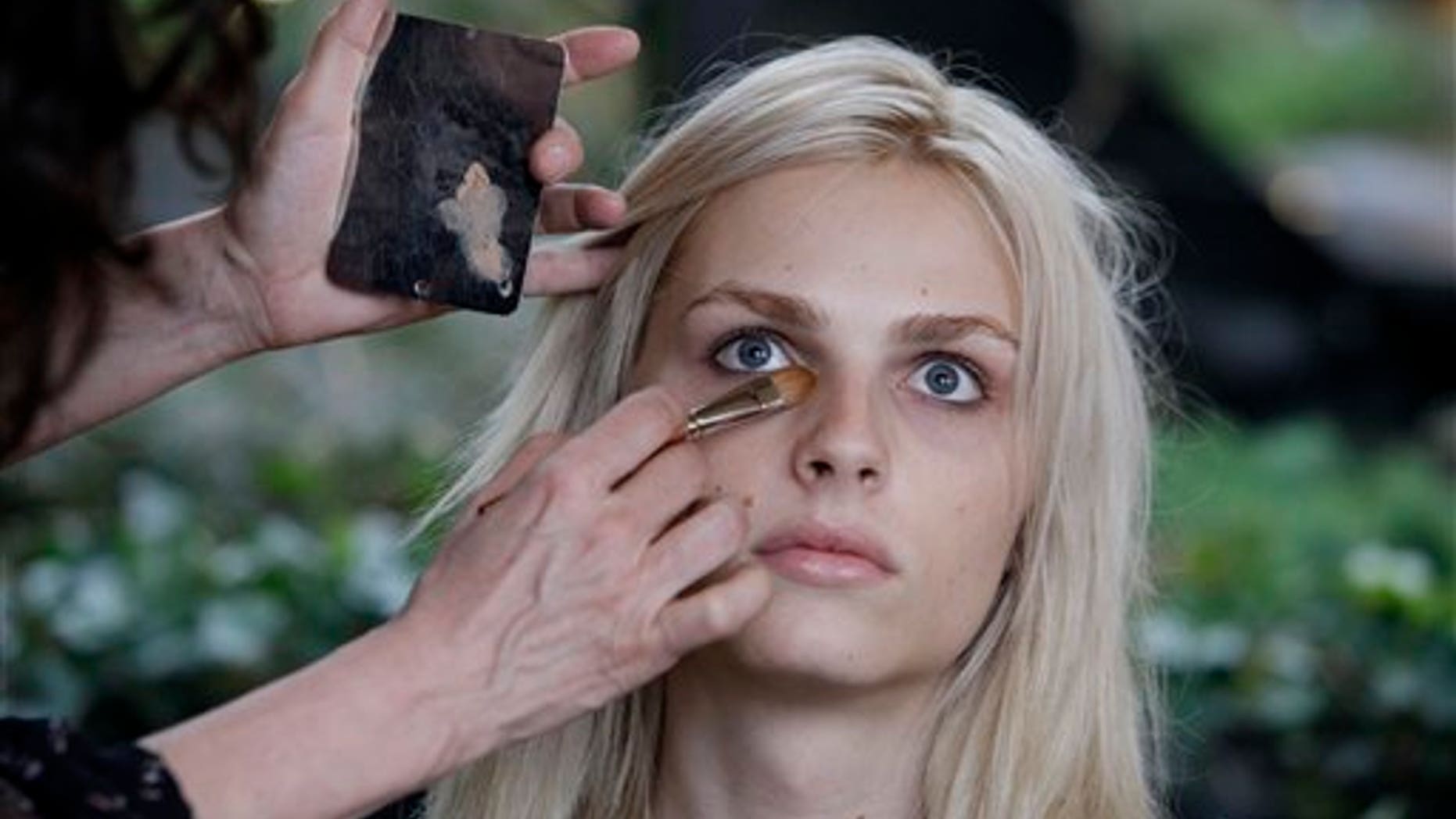 In this Jan. 27, 2012 photo, photographer transgender model Andrej Pejic has make-up applied by Cecelia Romero for a fashion shoot in New York. Transgender models have promoted the work of Marc Jacobs and Jean Paul Gaultier, but its a man with no plans for gender reassignment surgery whos straddling the line like no other. Pejic, 20, says hes perfectly happy being gender neutral. Some in the fashion industry see Pejic as a sign of a new gender fluidity. (AP Photo/Richard Drew)