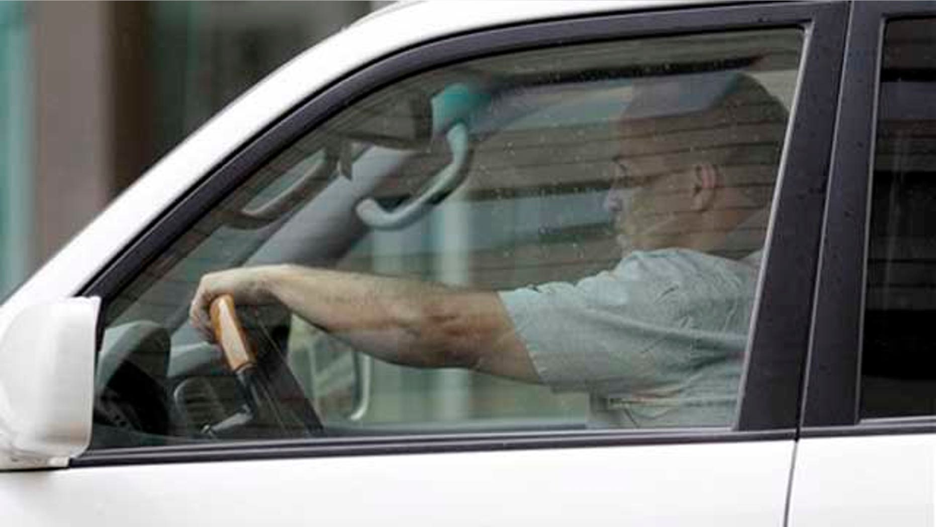Andrew Young stops at a traffic light in downtown Washington, Thursday, March 31, 2011. Prosecutors investigating former Sen. John Edwards are taking another look at Young, the man who posed as the father of Edwards' out-of-wedlock baby while he pursued the White House. The Associated Press spotted Young leaving his attorney's Washington office after prosecutors interviewed him for more than four hours Thursday.