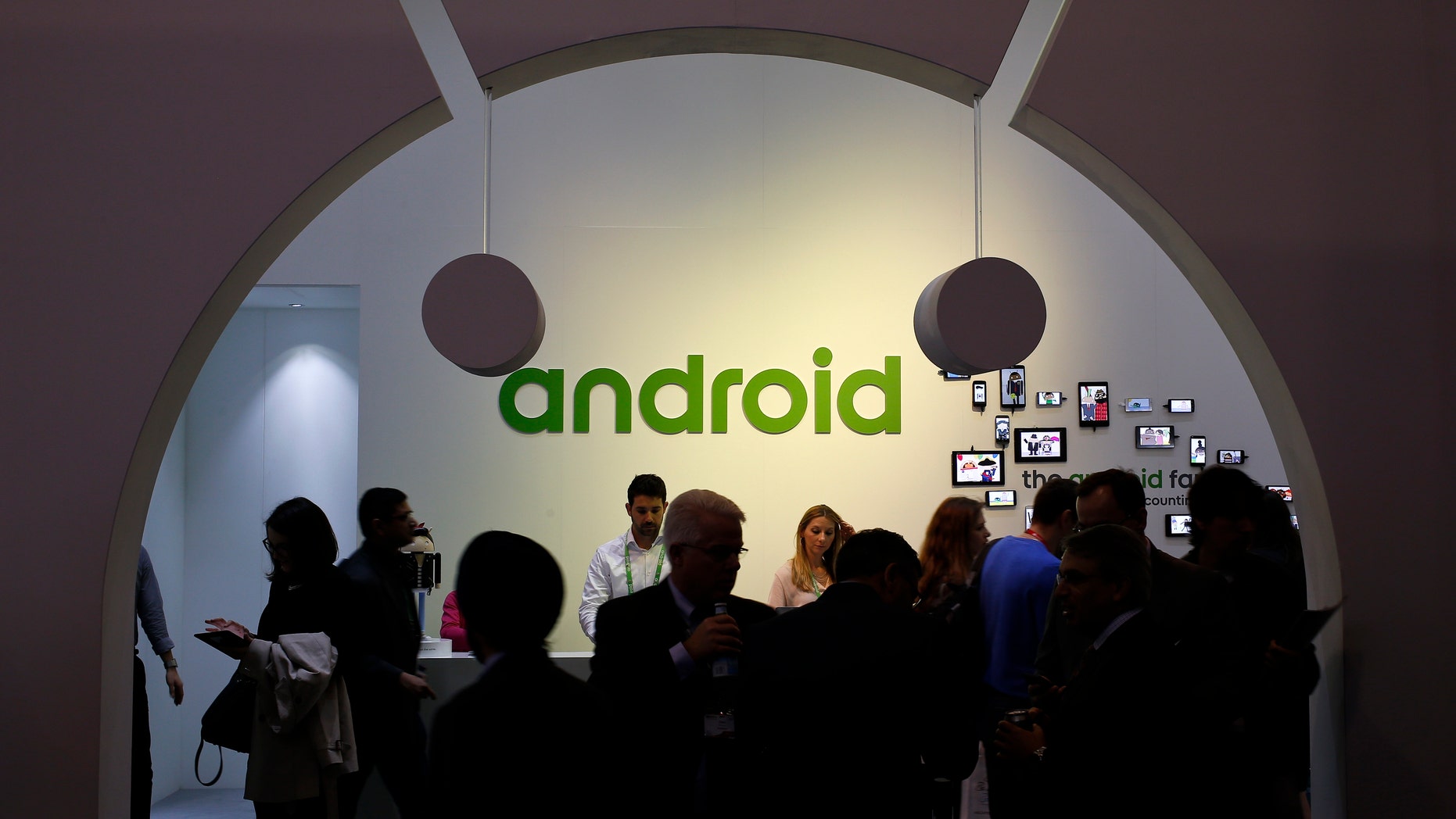 File photo - People visit an Android stand at the Mobile World Congress in Barcelona March 4, 2015.