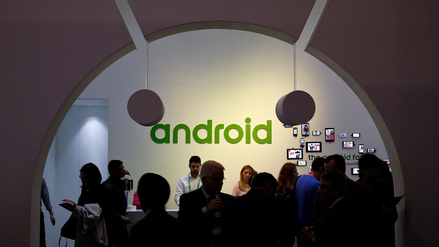 File photo - People visit an Android stand at the Mobile World Congress in Barcelona March 4, 2015.