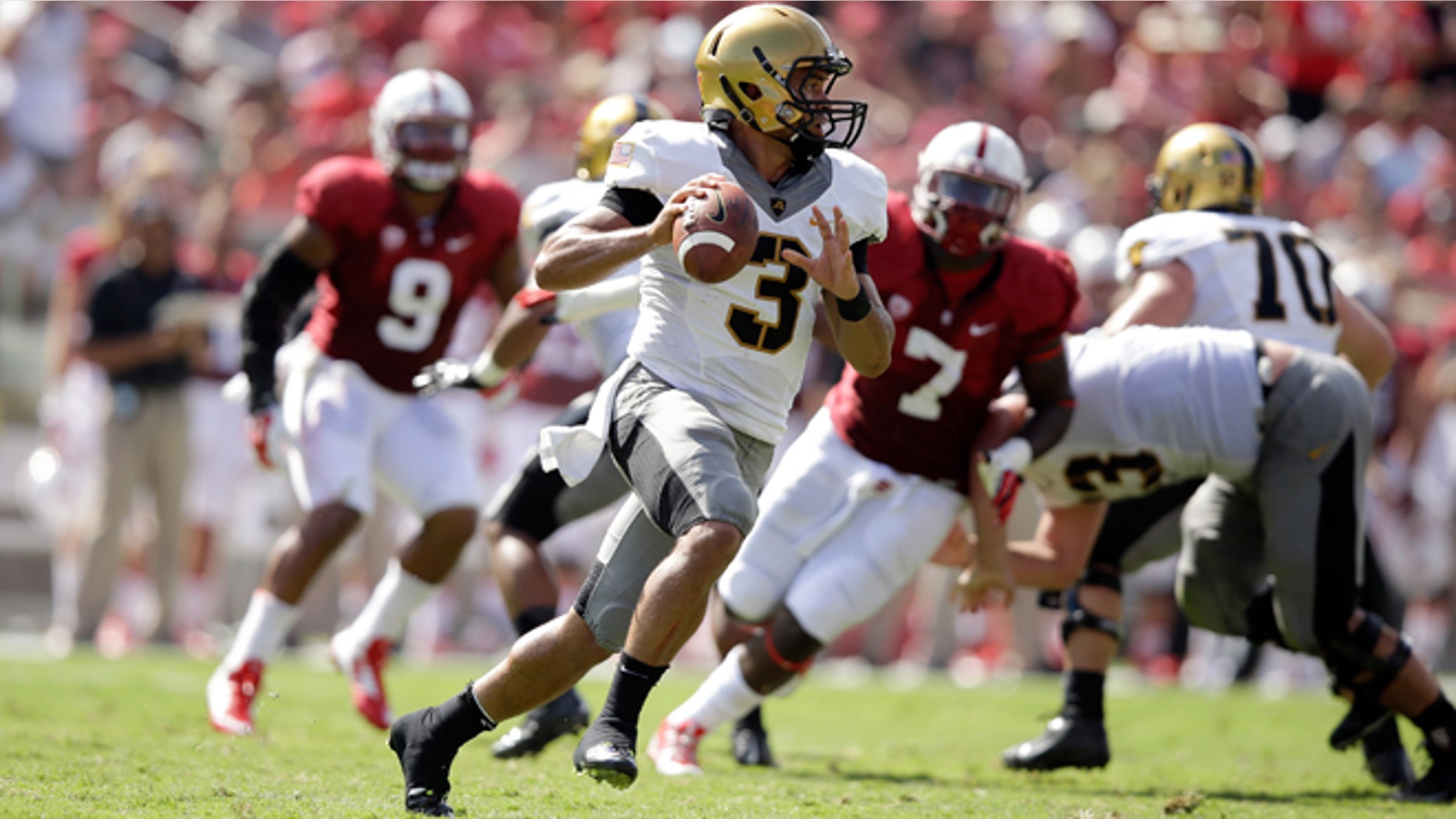 PALO ALTO, CA - SEPTEMBER 13: Angel Santiago #3 of the Army Black Knights looks to pass the ball against the Stanford Cardinal at Stanford Stadium on September 13, 2014 in Palo Alto, California. (Photo by Ezra Shaw/Getty Images)