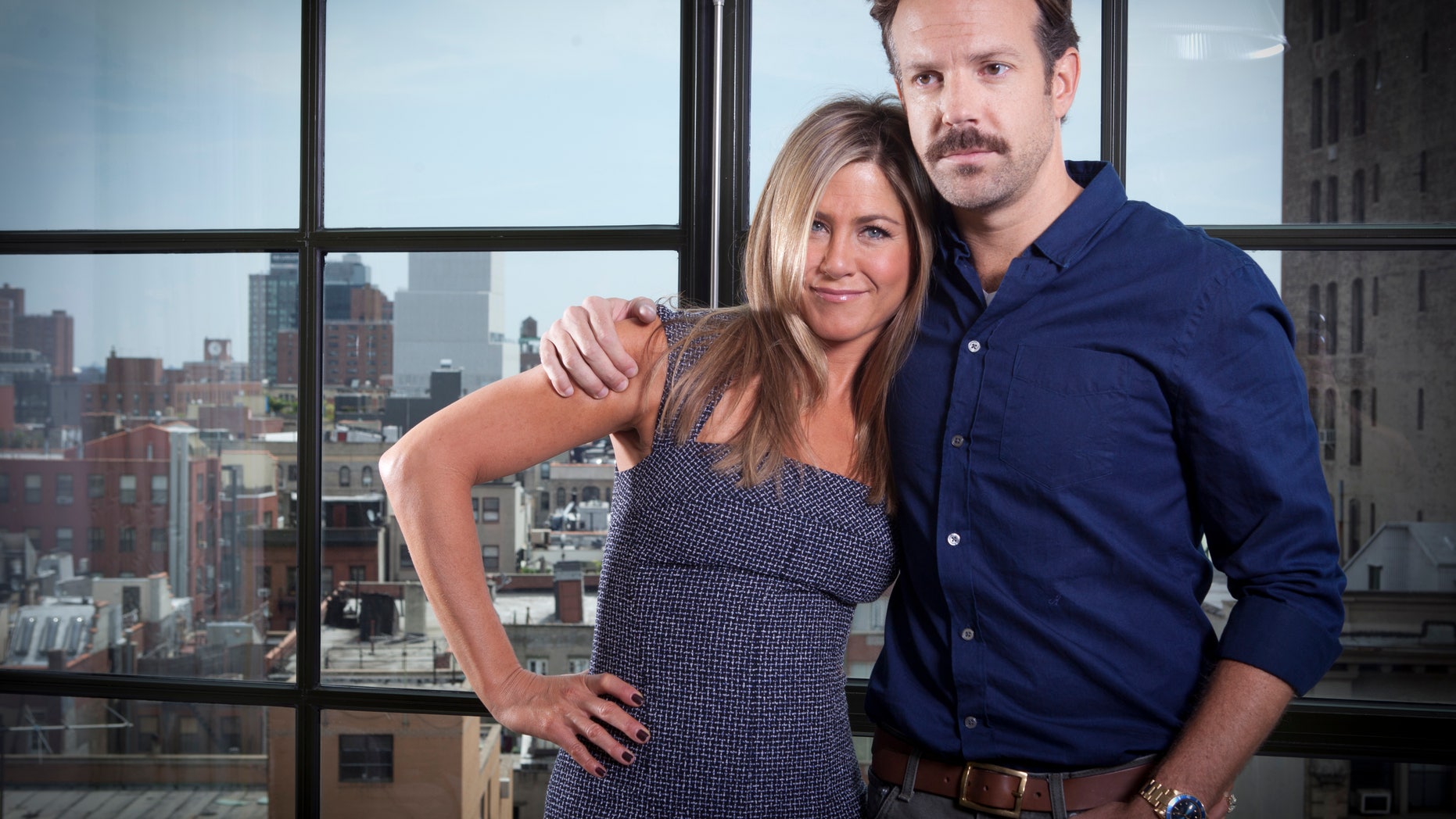 FILE - In this July 27, 2013 file photo, actor Jason Sudeikis, right, and actress Jennifer Aniston pose for a portrait as they promote the movie "We're the Millers" in New York. The film opens nationwide on Wednesday, Aug. 7. (Photo by Carlo Allegri/Invision/AP, File)