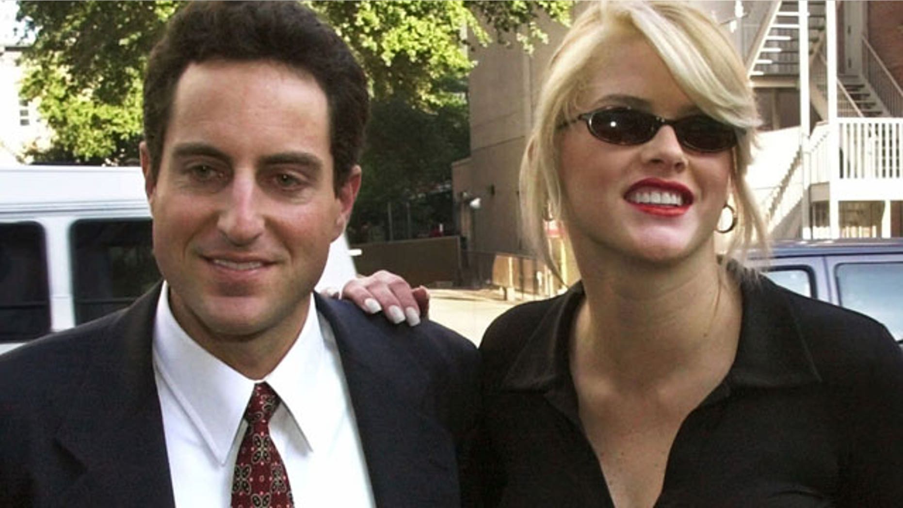 In this Oct. 2, 2000 file photo, Anna Nicole Smith, right, smiles as she walks to the courthouse with her attorney Howard K. Stern in Houston. Attorneys in the Anna Nicole Smith drug conspiracy trial are set with final arguments aimed at swaying jurors in reaching a complicated and crucial set of verdicts that will affect two doctors and the deceased model's former boyfriend.