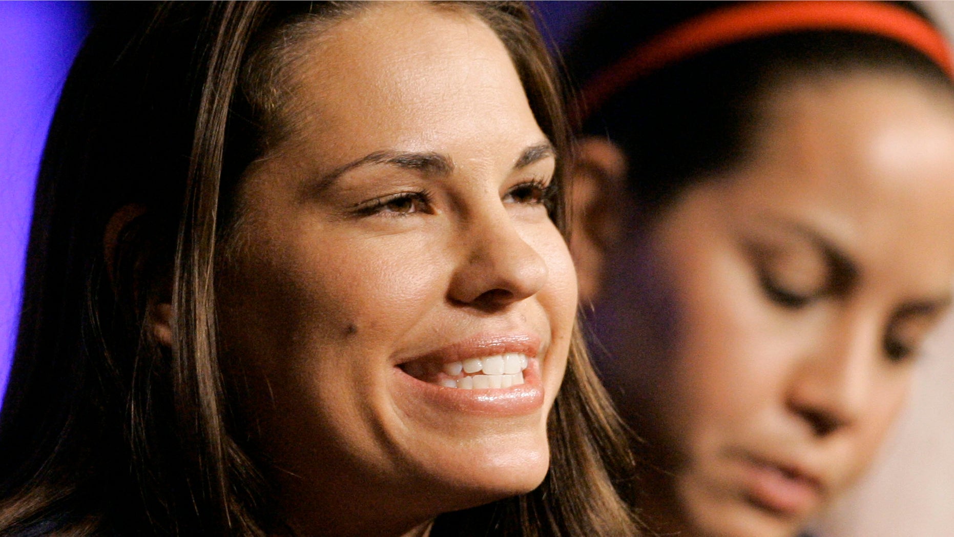 FILE - In this April 14, 2008 file photo, U. S. Olympic softball team member Jessica Mendoza, left, speaks during the 2008 U.S. Olympic Team media summit in Chicago. Mendoza was a teenager and wondering whether it was cool to play sports when she heard an Olympic softball player speak about her love of the game. Now she's heading to the World Series to give updates for "Baseball Tonight" on ESPN, shortly after becoming the first female analyst to call a nationally televised MLB postseason game, Tuesday, Oct. 20, 2015. (AP Photo/M. Spencer Green, File)