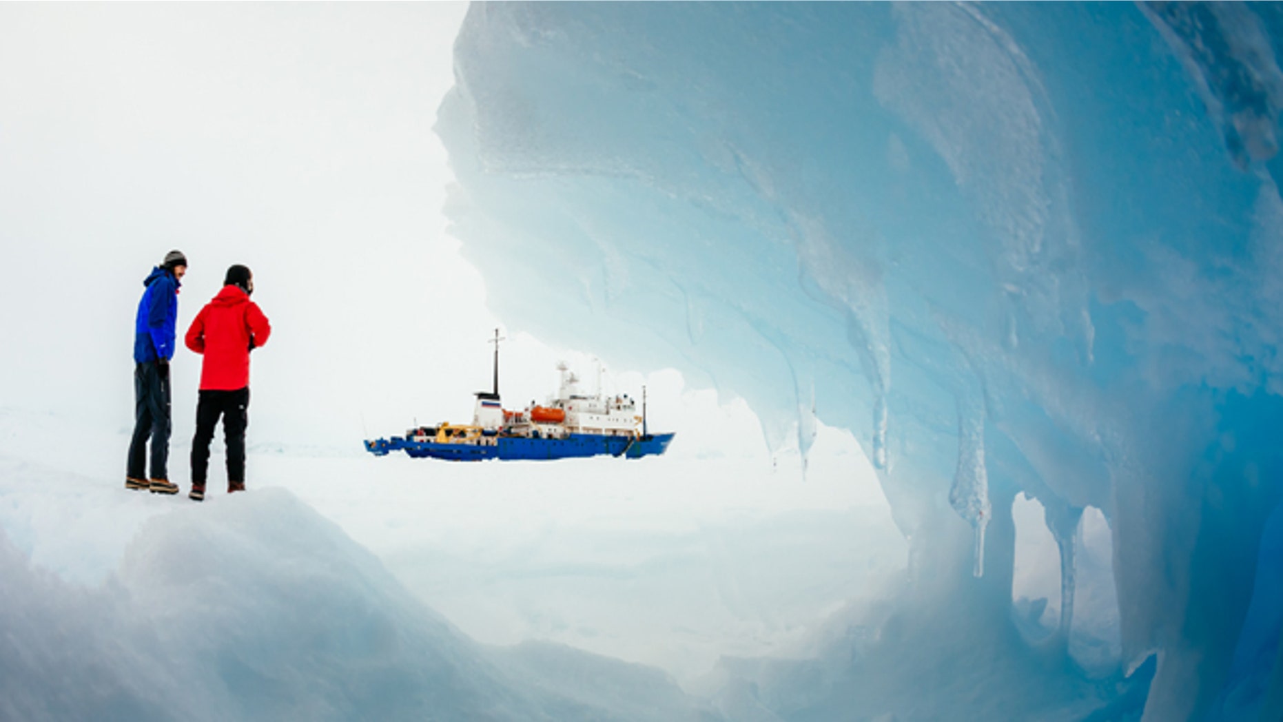 Passengers from the trapped Russian ship MV Akademik Shokalskiy walk around the ice, Dec. 31, 2013.