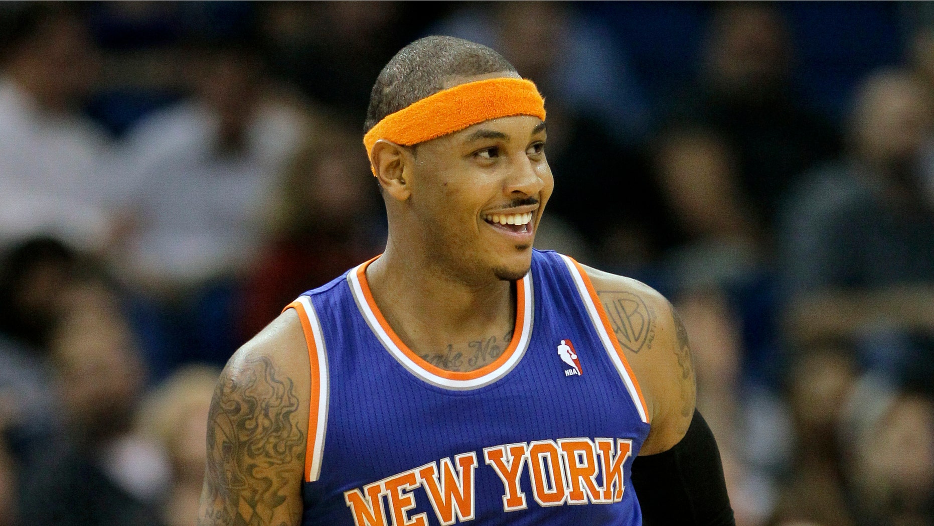 New York Knicks' Carmelo Anthony hold out three fingers on his hand after sinking a 3-point shot against the Orlando Magic during the fourth quarter of an NBA basketball game, Tuesday,Nov. 13, 2012, in Orlando, Fla. The Knicks won 99-89. Anthony scored 25 points. (AP Photo/John Raoux)