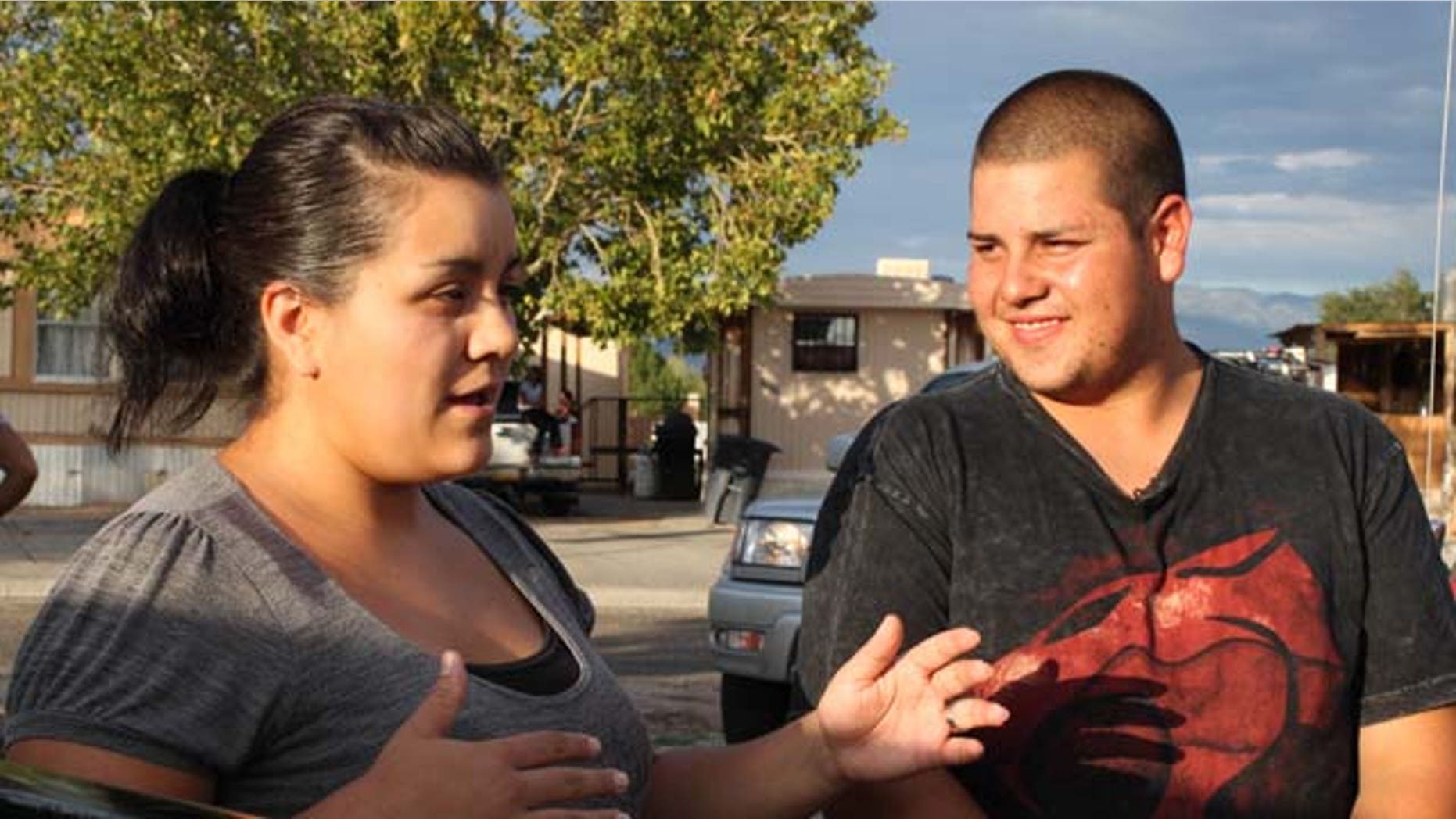 Martha Diaz and her husband Antonio Diaz Chacon talk to reporters about Diaz Chacon's efforts to save a 6-year-old girl who was abducted in Albuquerque, N.M., on Aug. 16, 2011. (AP Photo/Susan Montoya Bryan)