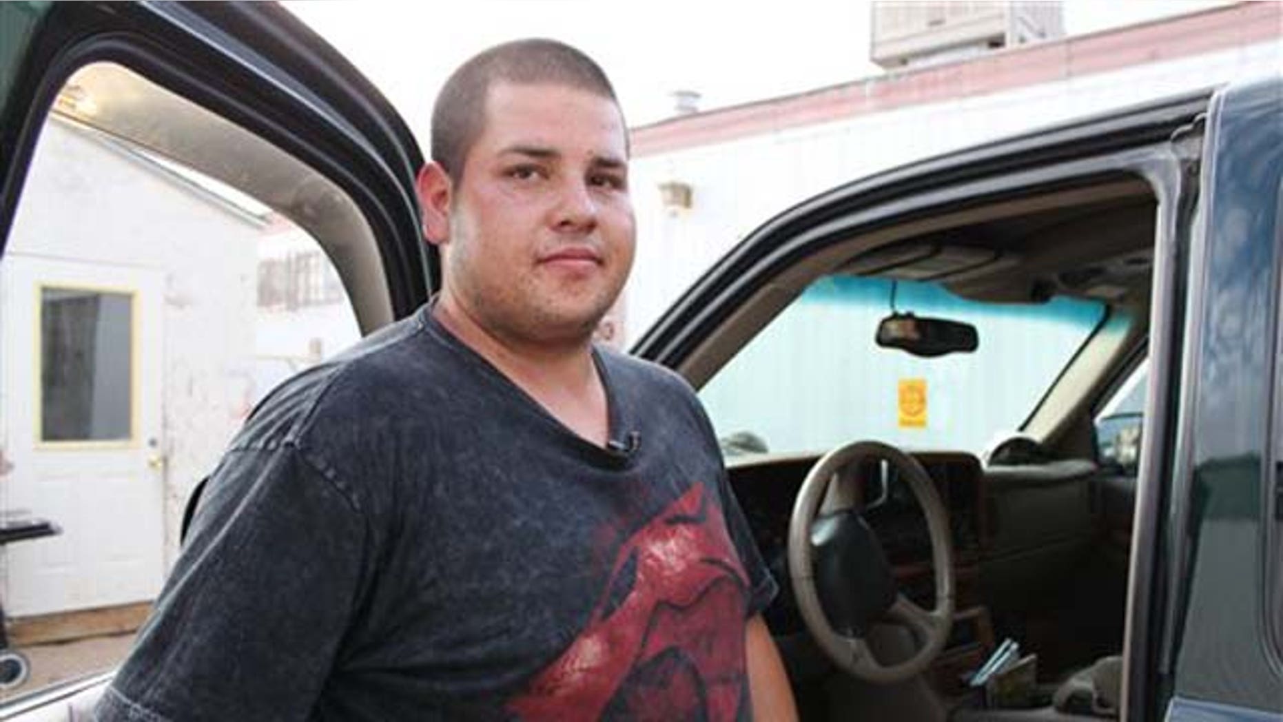 Aug. 16, 2011: Antonio Díaz Chacón stands next to his truck while talking to reporters about his efforts to save a 6-year-old girl who was abducted during an interview in front of his home in Albuquerque, N.M.