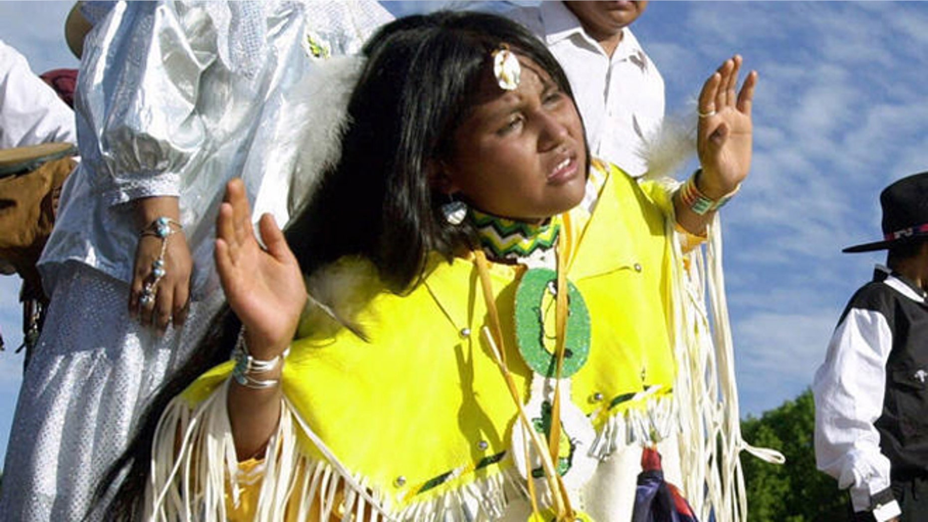 An Apache girl dances at a gathering. The Lipan Apache Tribe of Texas hopes to overturn a federal law that it claims violates the civil liberties and religious freedom of the tribe.