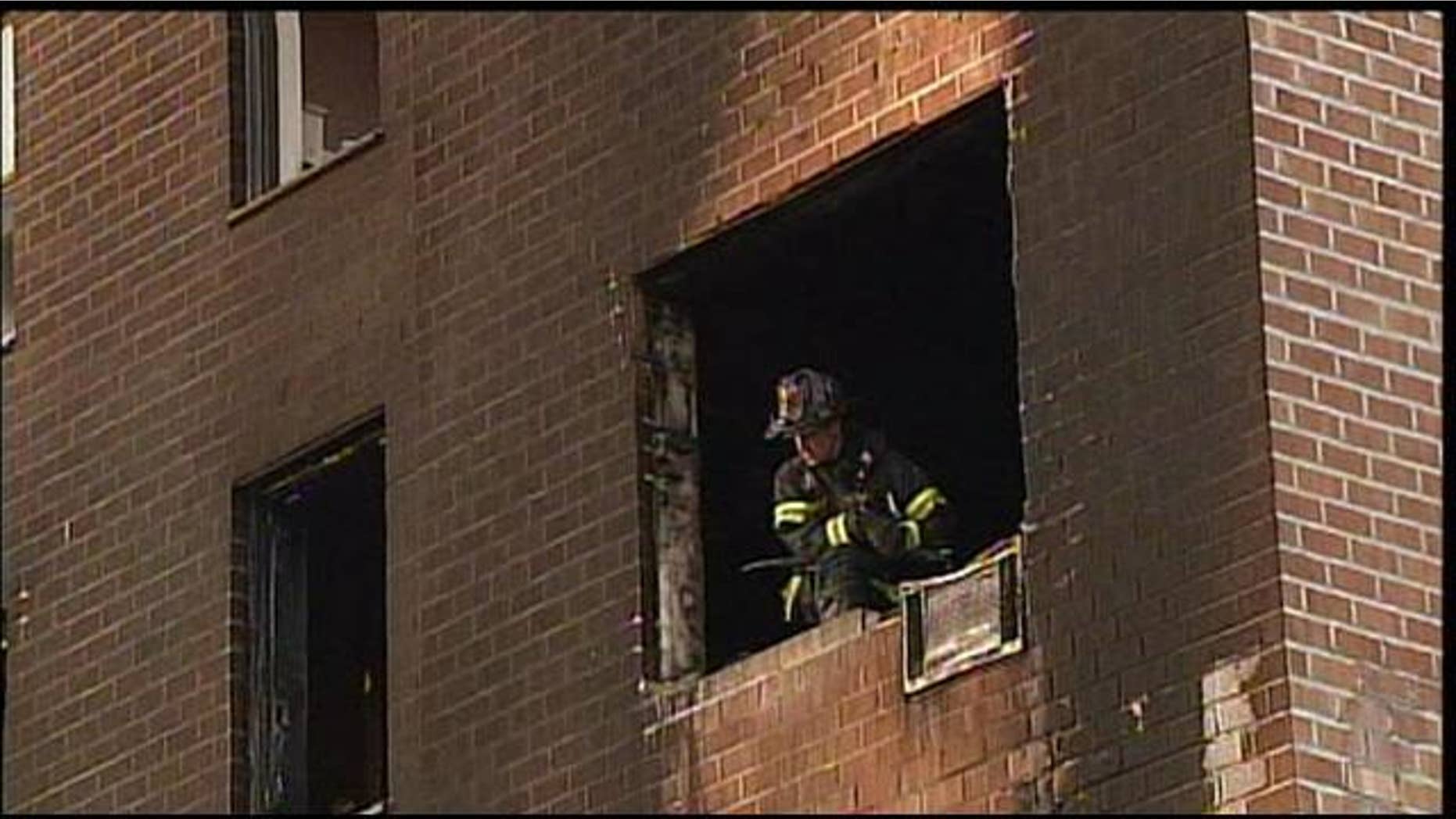June 17, 2012: A firefighter is seen at the scene of an apartment fire in New York.