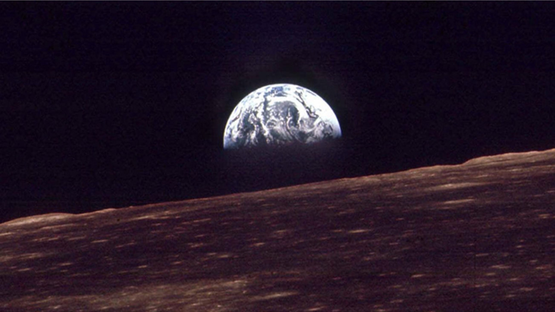 In this Dec. 24, 1968 photo, the Earth shines over the horizon of the Moon in as seen by the astronauts on Apollo 8. Apollo 8 was launched from Cape Canaveral on Dec. 21, 1968.
