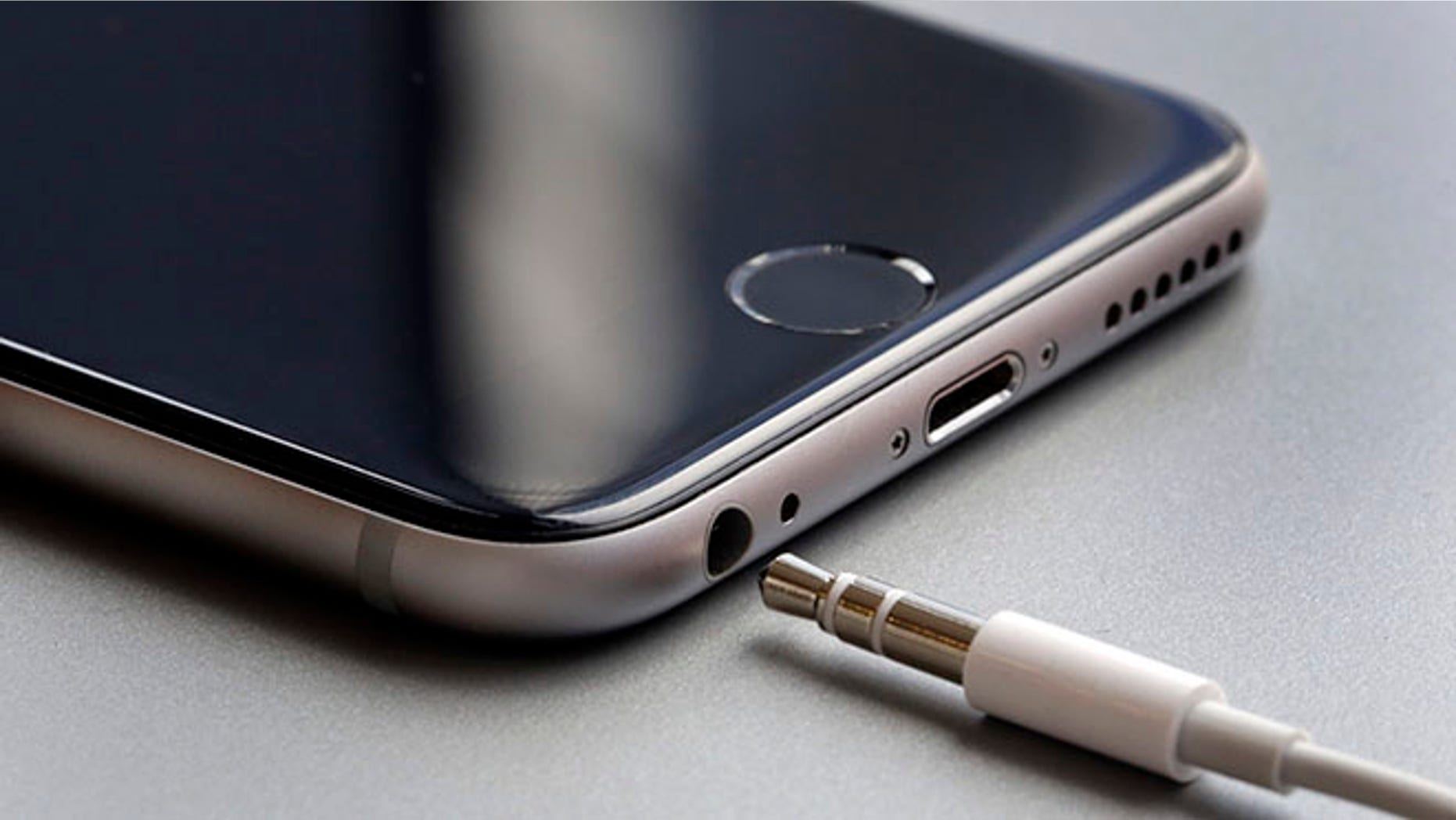 This Sept. 2, 2016, photo shows the earphone jack and charging port on an Apple iPhone 6, in New York. Apple is getting ready to unveil new iPhones on Wednesday, Sept. 7. With experts predicting few big changes from last year's models, speculation has focused on Apple's rumored decision to eliminate the iPhone's traditional headphone jack. It isn't clear what kind of hardware the company will promote instead, but the answer could be a hint at some of Apple's future plans. (AP Photo/Richard Drew)