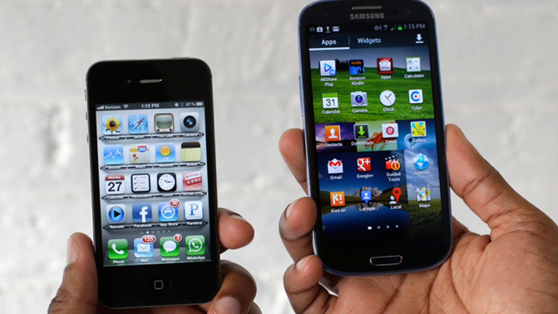 In this Aug. 27, 2012 photo, the Apple iPhone 4s, left, is displayed next to the Samsung Galaxy S III at a store in San Francisco. Apple already has won nearly $1 billion in judgments against Samsung over patent infringements involving older-model devices. Now Apple is alleging Samsungâs newest devices, such as its Galaxy S III, also copied Apple technology. Jury selection for the case begins Monday, March 31, 2014. (AP Photo/Marcio Jose Sanchez)
