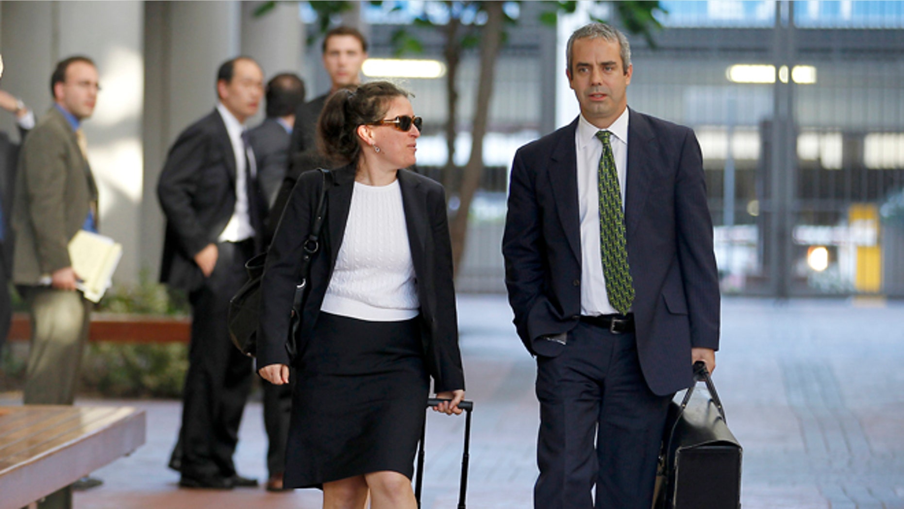 Aug 24, 2012: Kevin Johnson, right, and Victoria Maroulis, left, attorneys for Samsung, leave the US Courthouse and Federal building after a jury reached a decision in the Apple Samsung trial in San Jose, Calif. The jury ordered Samsung to pay Apple $1.05 billion. An appeal is expected.