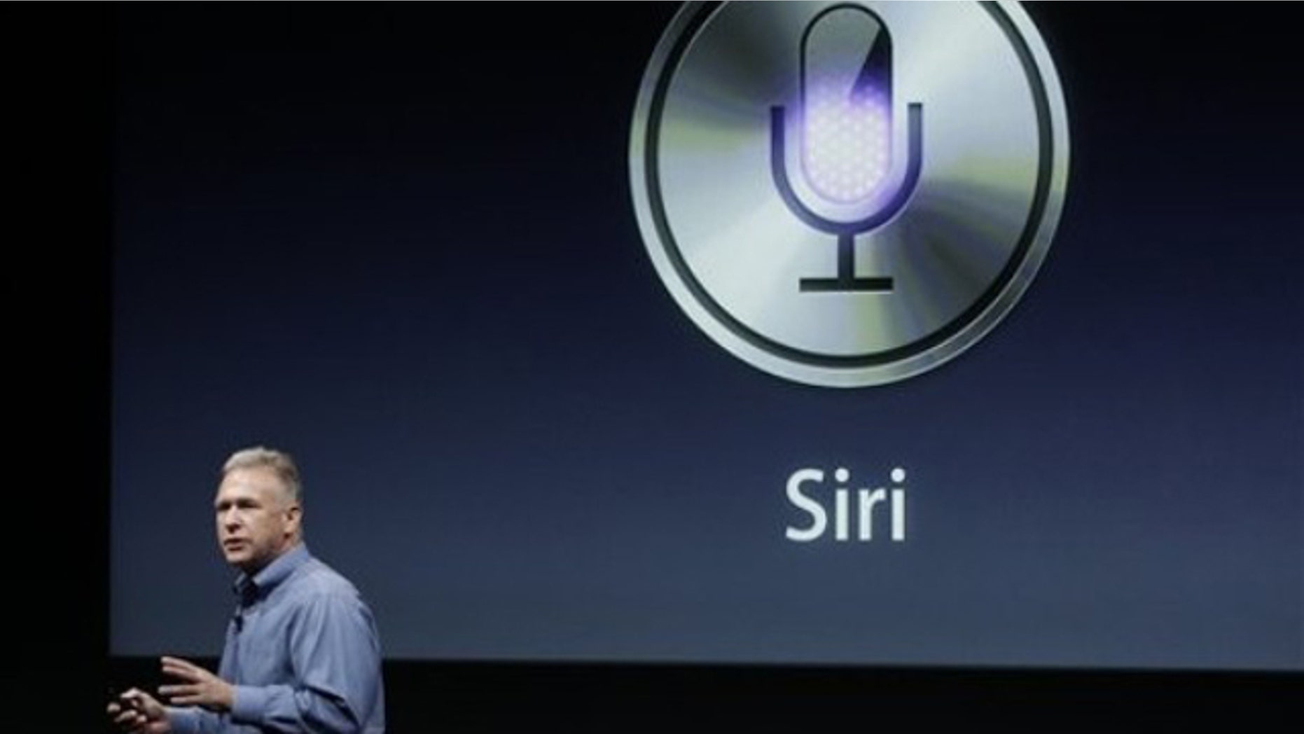 Oct. 4, 2011: Apple's Phil Schiller talks about Siri with the new Apple iPhone 4S during an announcement at Apple headquarters in Cupertino, Calif.