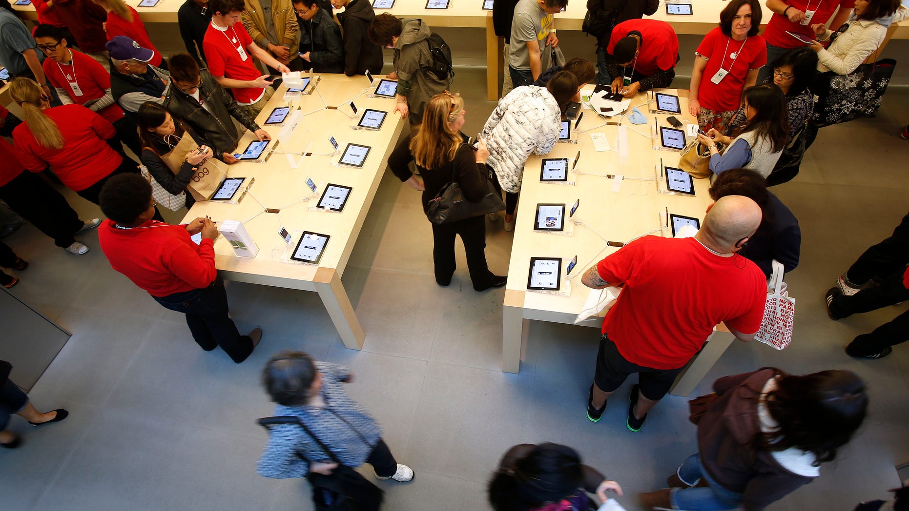 File photo. Holiday shoppers shop at the Apple Store during Black Friday in San Francisco, California, November 23, 2012. John R. Quain has some more unconventional tech gift choices this holiday season.