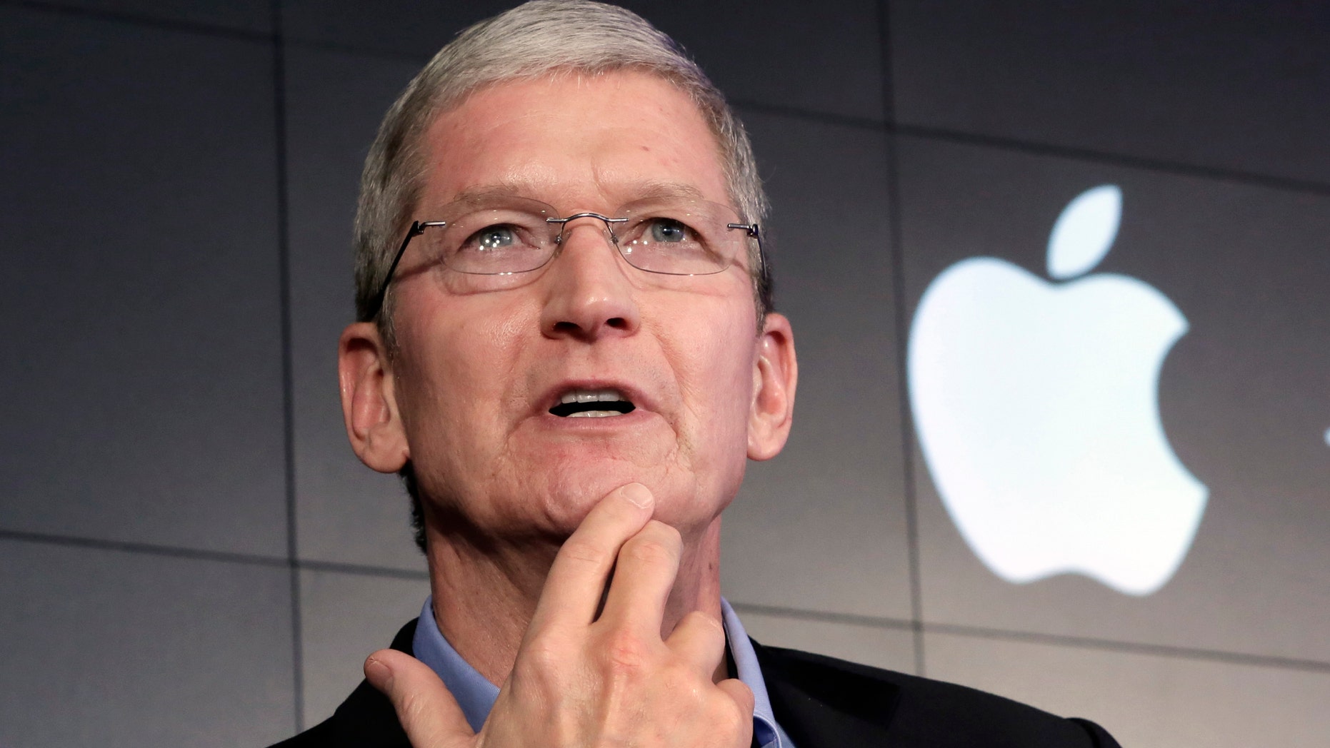 Apple CEO Tim Cook responds to a question during a news conference at IBM Watson headquarters, in New York, Thursday, April 30, 2015.