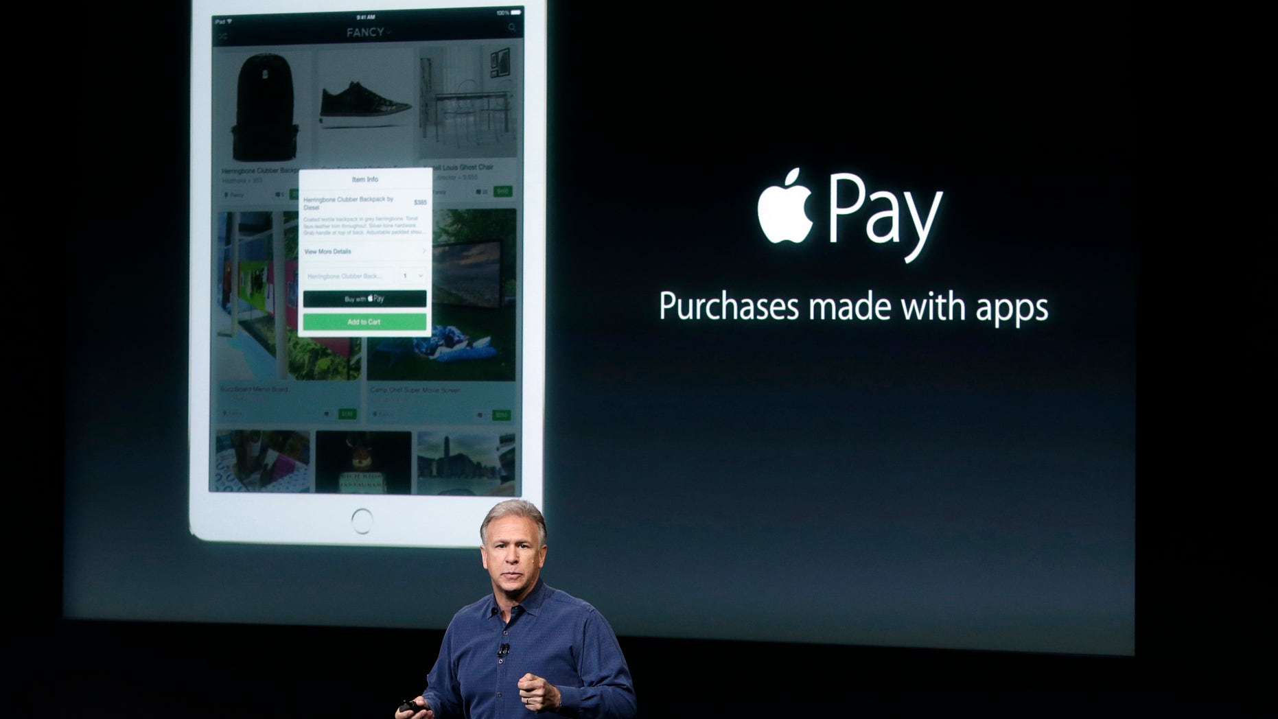 Phil Schiller, Apple's senior vice president of worldwide product marketing, discuss the features of the new Apple iPad Air 2 and Apple Pay during an event at Apple headquarters on Oct. 16, 2014.