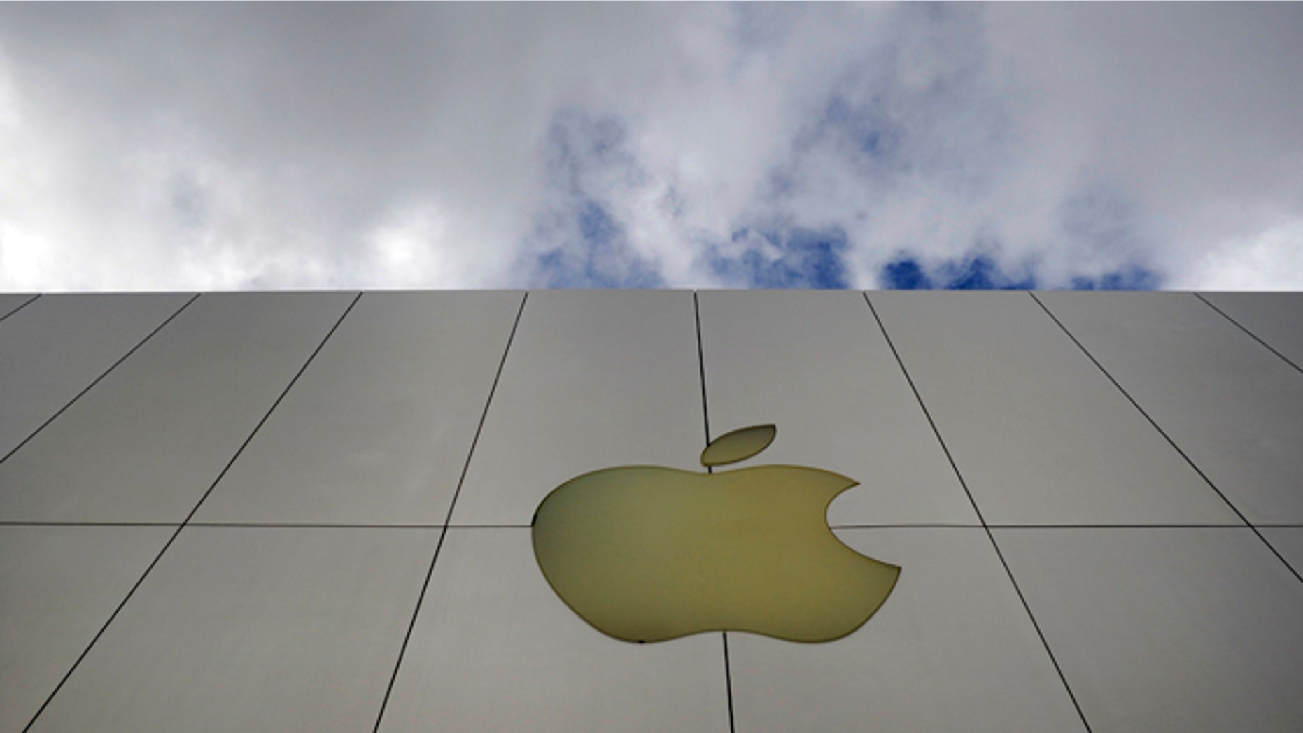 The Apple logo is displayed outside one of the company's stores.