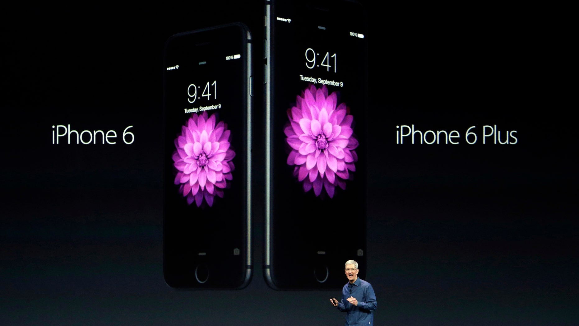 Apple CEO Tim Cook introduces the new iPhone 6 and iPhone 6 Plus on Tuesday, Sept. 9, 2014, in Cupertino, Calif. (AP Photo/Marcio Jose Sanchez)
