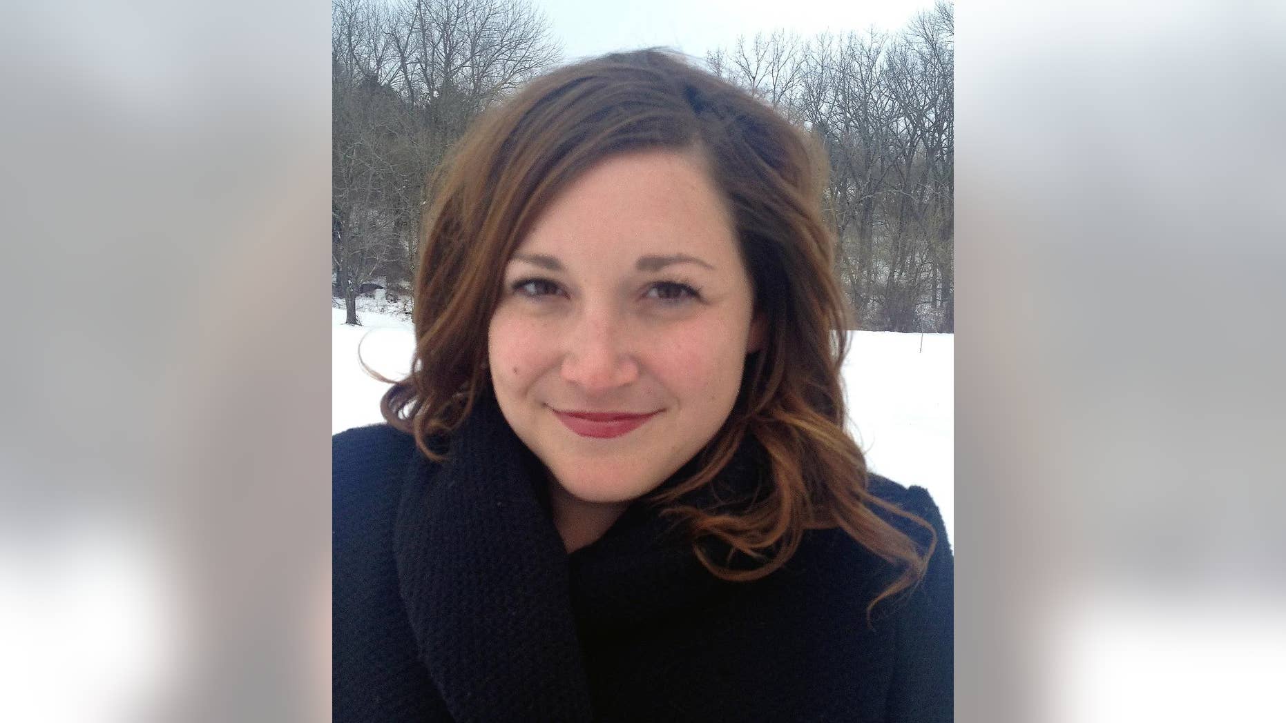 In this undated photo released by Jessie Burnett, Claire Galofaro poses for a photo. The Associated Press has named Claire Galofaro, a veteran newspaper reporter and Louisville native, as its administrative correspondent for Kentucky and Tennessee. Galofaro, 32, most recently worked at The Courier-Journal, where she covered criminal justice and social services. (AP Photo/Jessie Burnett)