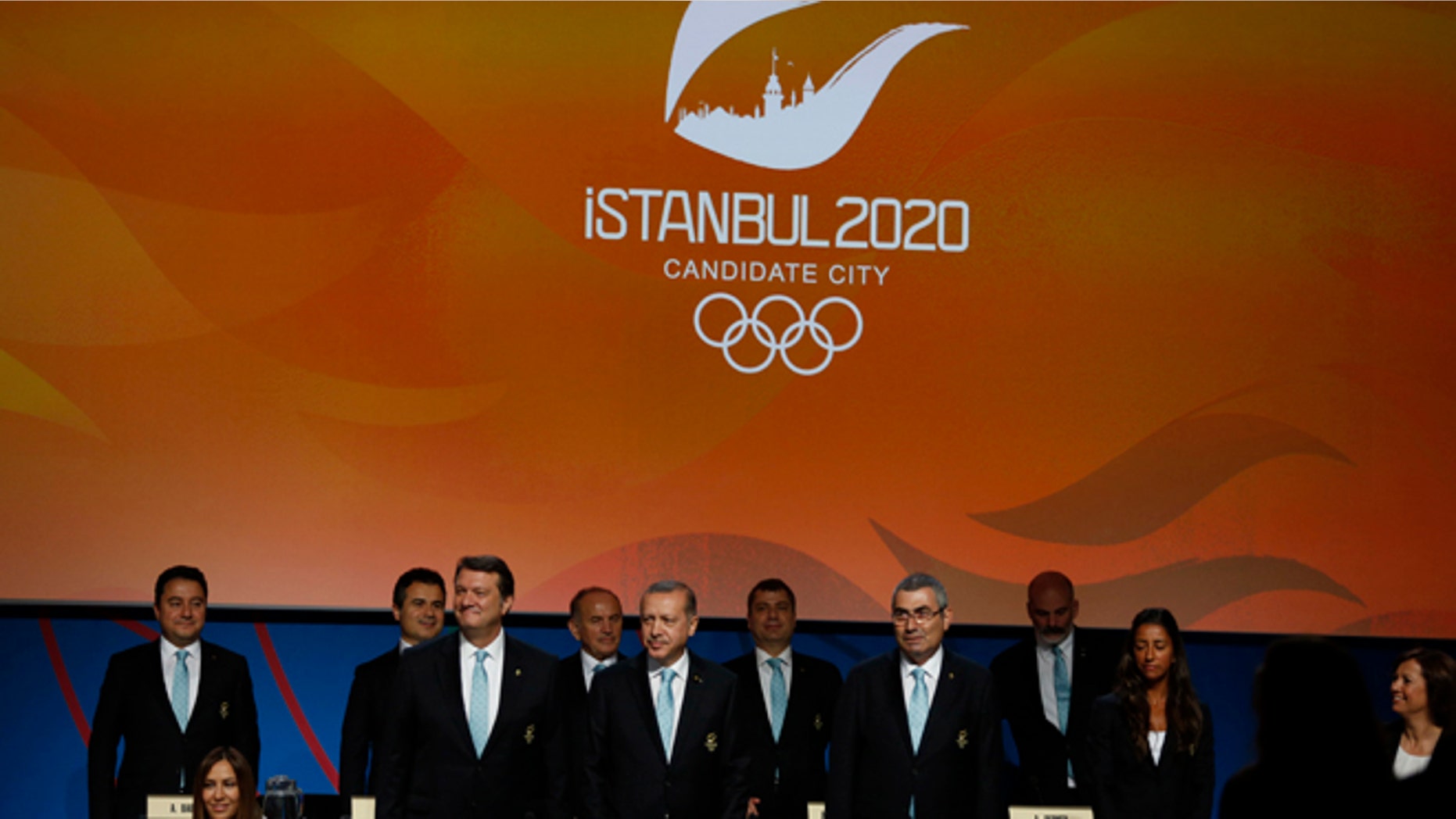 Turkey's delegation arrives to the Istanbul 2020 bid presentation during the International Olympic Committee session, Saturday, Sept. 7, 2013, in Buenos Aires, Argentina. Madrid, Istanbul and Tokyo are competing to host the 2020 Summer Olympic Games. (AP Photo/Natacha Pisarenko)