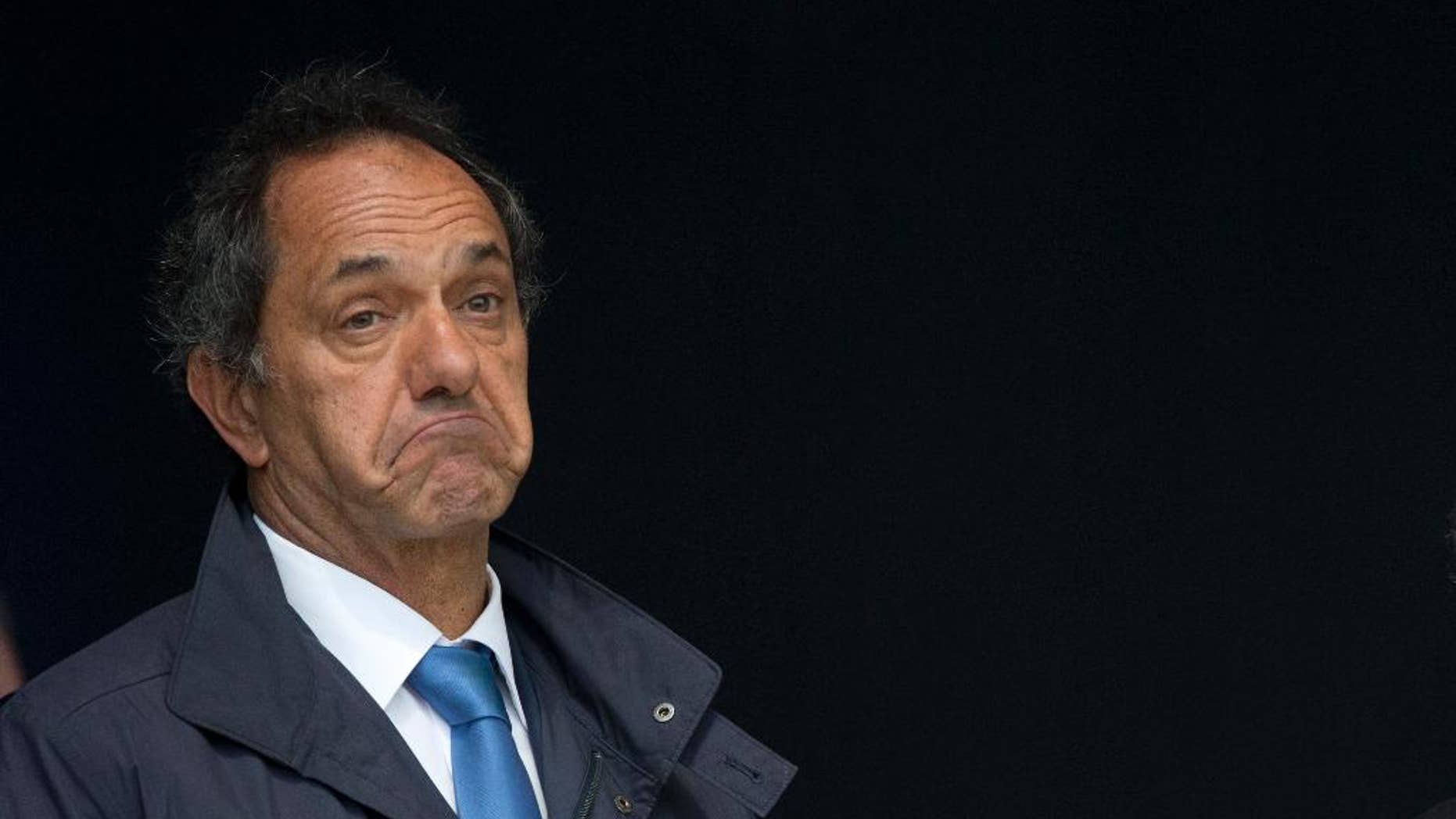 FILE - In this Sept. 9, 2015, file photo, Daniel Scioli, governor of Buenos Aires province and presidential hopeful, gestures at the inauguration of a heath center in the suburbs of Buenos Aires, Argentina. Scioli said late Wednesday, Sept. 23, that he would not participate in the debate unless there was a law regulating it. Scioli is leading in the polls ahead of the Oct. 25 election. (AP Photo/Natacha Pisarenko, File)