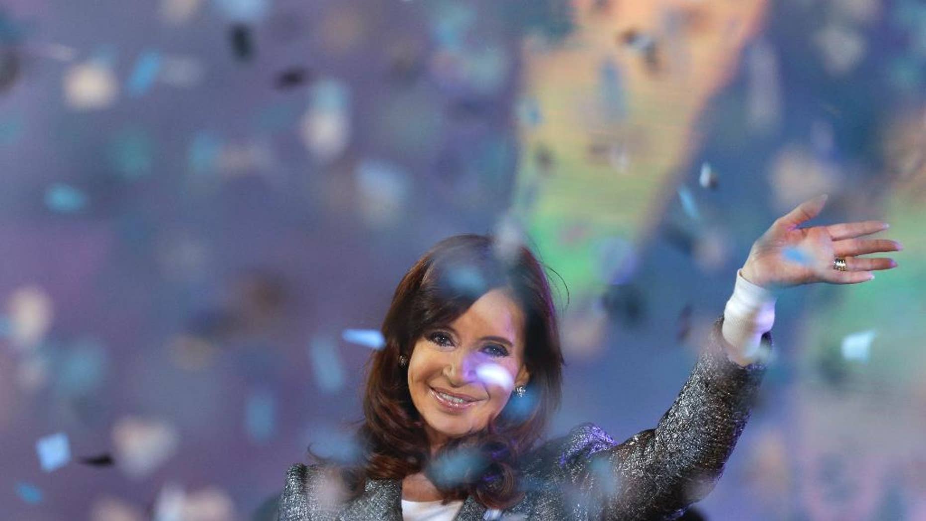 FILE - In this May 25, 2015, file photo, Argentina’s President Cristina Fernandez smiles to supporters during the celebration of the 25 of May holiday at Plaza de Mayo in Buenos Aires, Argentina. It was announced Sunday, June 21, that Fernandez will not run for any public office once she leaves the presidency on December 10. (AP Photo/Natacha Pisarenko, File)