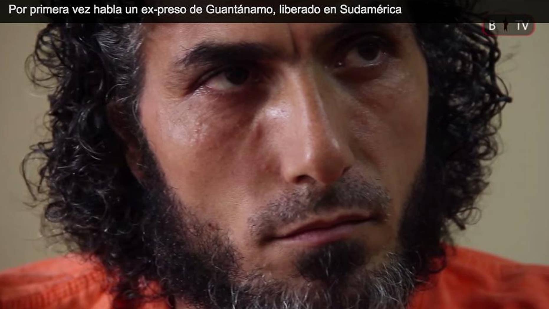 FILE - In this file photo of a frame grab from Barricada TV, recorded on Feb. 11, 2015, Abu Wa’el Dhiab, one of the Syrian refugees released from Guantanamo and now living in Uruguay, speaks during an interview, in Buenos Aires, Argentina. Dhiab, who led hunger strikes as a detainee and was resettled in Uruguay along with five other ex-inmates, is requesting a meeting with Uruguay's foreign minister to talk about the men’s future. The men were resettled in Uruguay in December 2014. (AP Photo/Barricada TV, File)