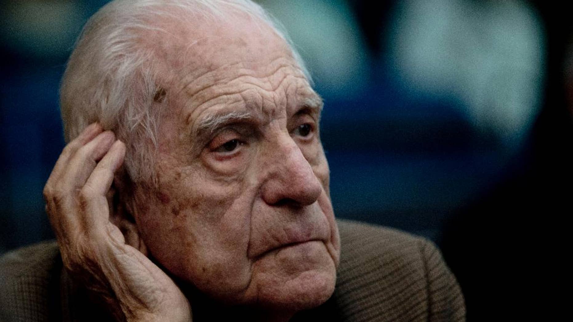 FILE- In this March 5, 2013 file photo, former dictator Reynaldo Bignone attends the first day of the trial for his alleged involvement in the so called operation, "Plan Condor,” in Buenos Aires, Argentina. The last military president in Argentina's 1976-1983 dictatorship received another prison sentence on Tuesday Oct. 7, 2014, this time for the kidnapping and torture of 32 factory workers. A court in Buenos Aires sentenced Reynaldo Bignone to 23 years in prison for the human rights violations. (AP Photo/Natacha Pisarenko, File)