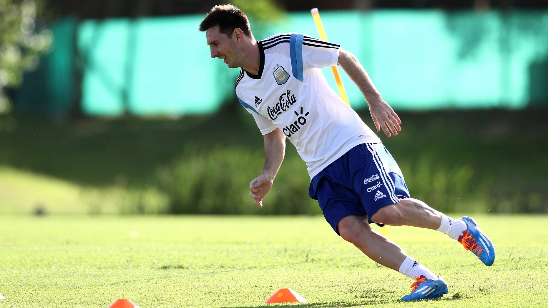 In this picture released by Argentina's Soccer Federation, Lionel Messi trains at Argentina's training facilities in the outskirts of Buenos Aires, Thursday, Dec. 5, 2013. Messi is in Argentina recovering from an injury. (AP Photo/Shu Kitayama,Argentina's Soccer Federation)