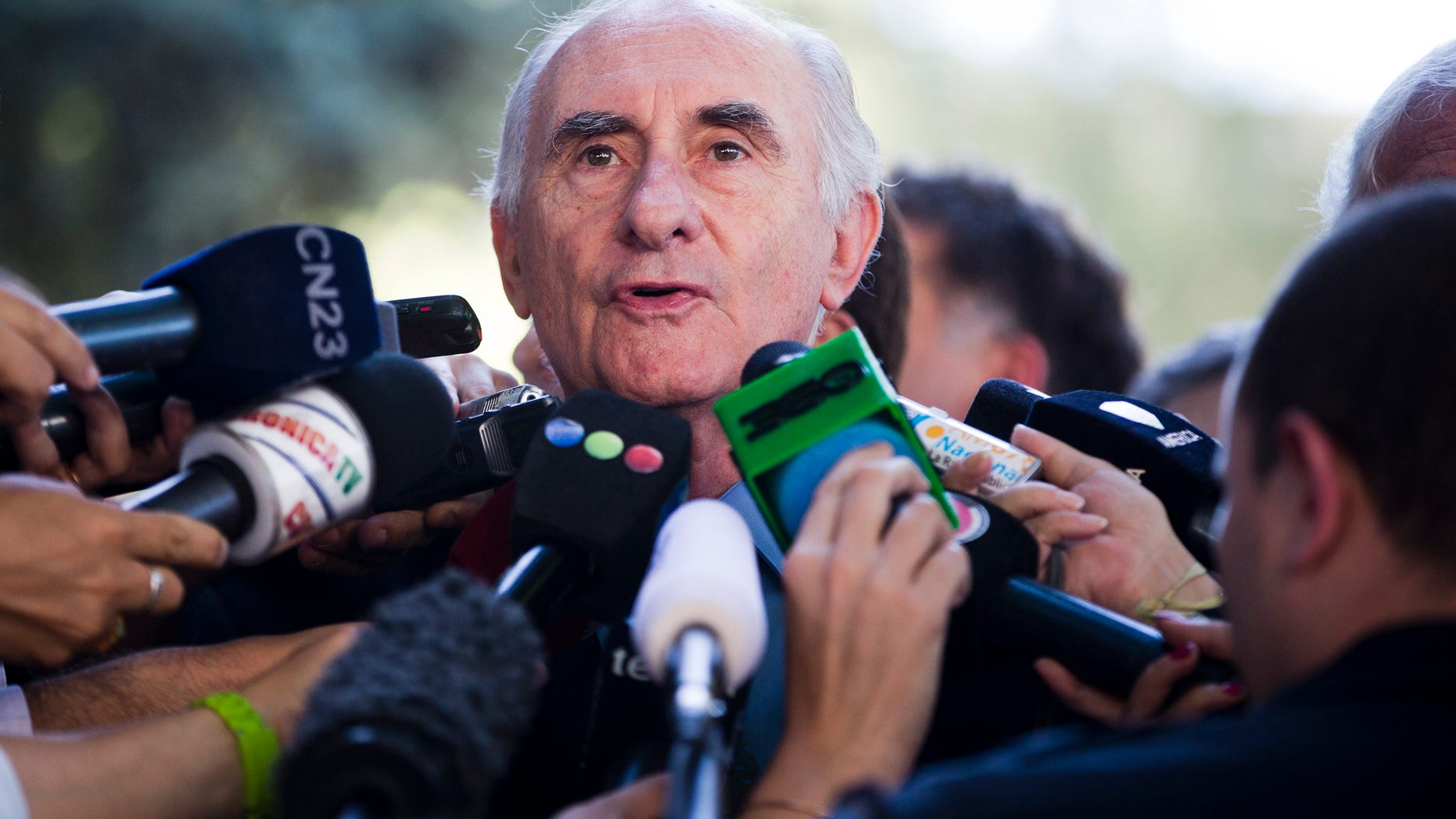 Former Argentine President Fernando de la Rua speaks to the media Monday, Dec. 23, 2013.
