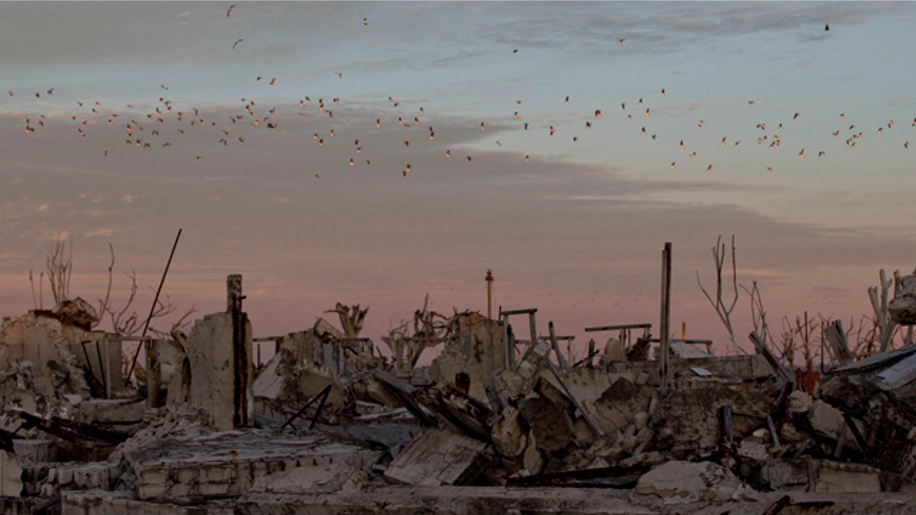 May 7, 2013: Birds fly over the village of Epecuen, Argentina.