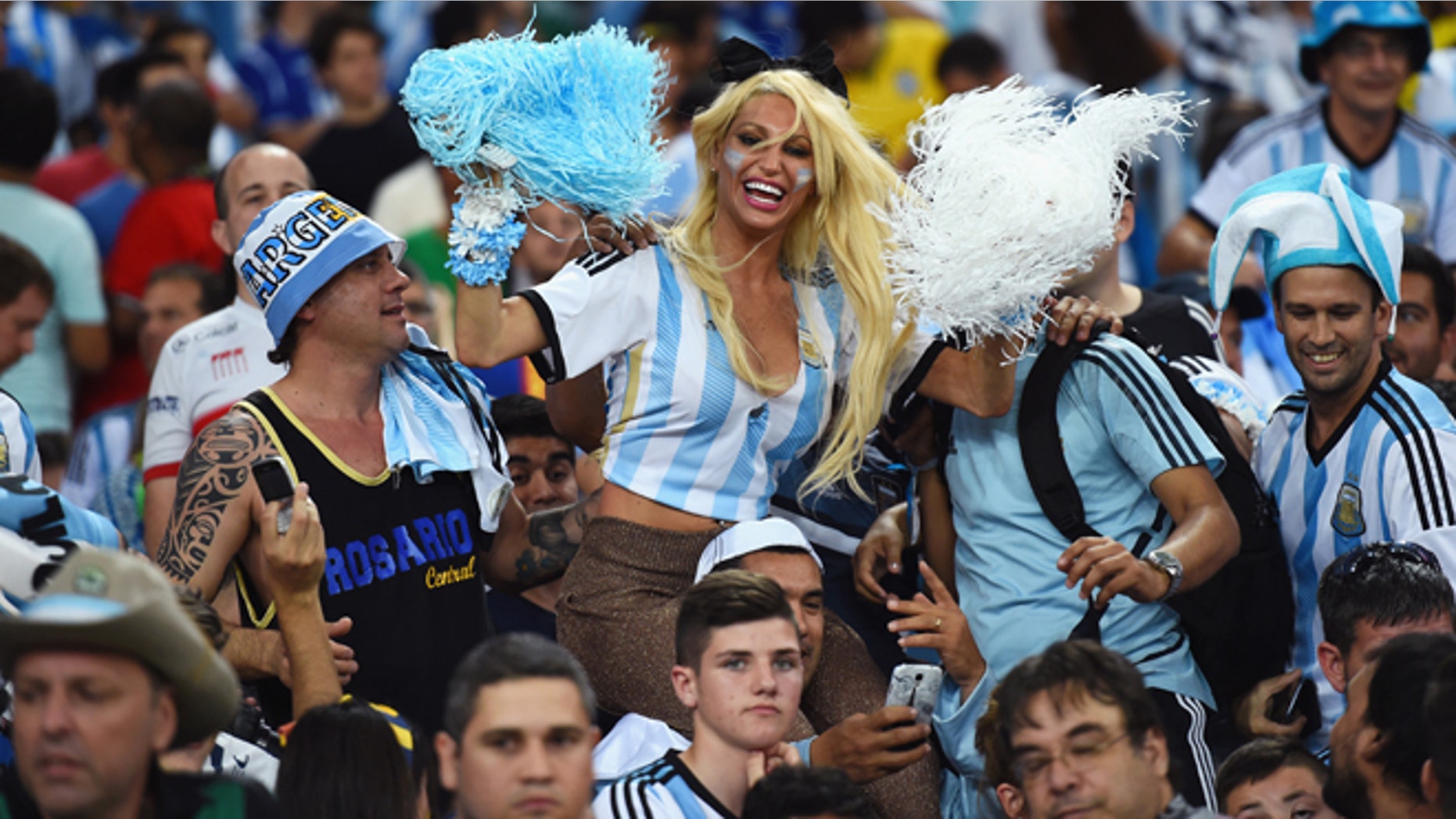 RIO DE JANEIRO, BRAZIL - JUNE 15: An Argentina fan cheers in the crowd prior to the 2014 FIFA World Cup Brazil Group F match between Argentina and Bosnia-Herzegovina at Maracana on June 15, 2014 in Rio de Janeiro, Brazil. (Photo by Matthias Hangst/Getty Images)