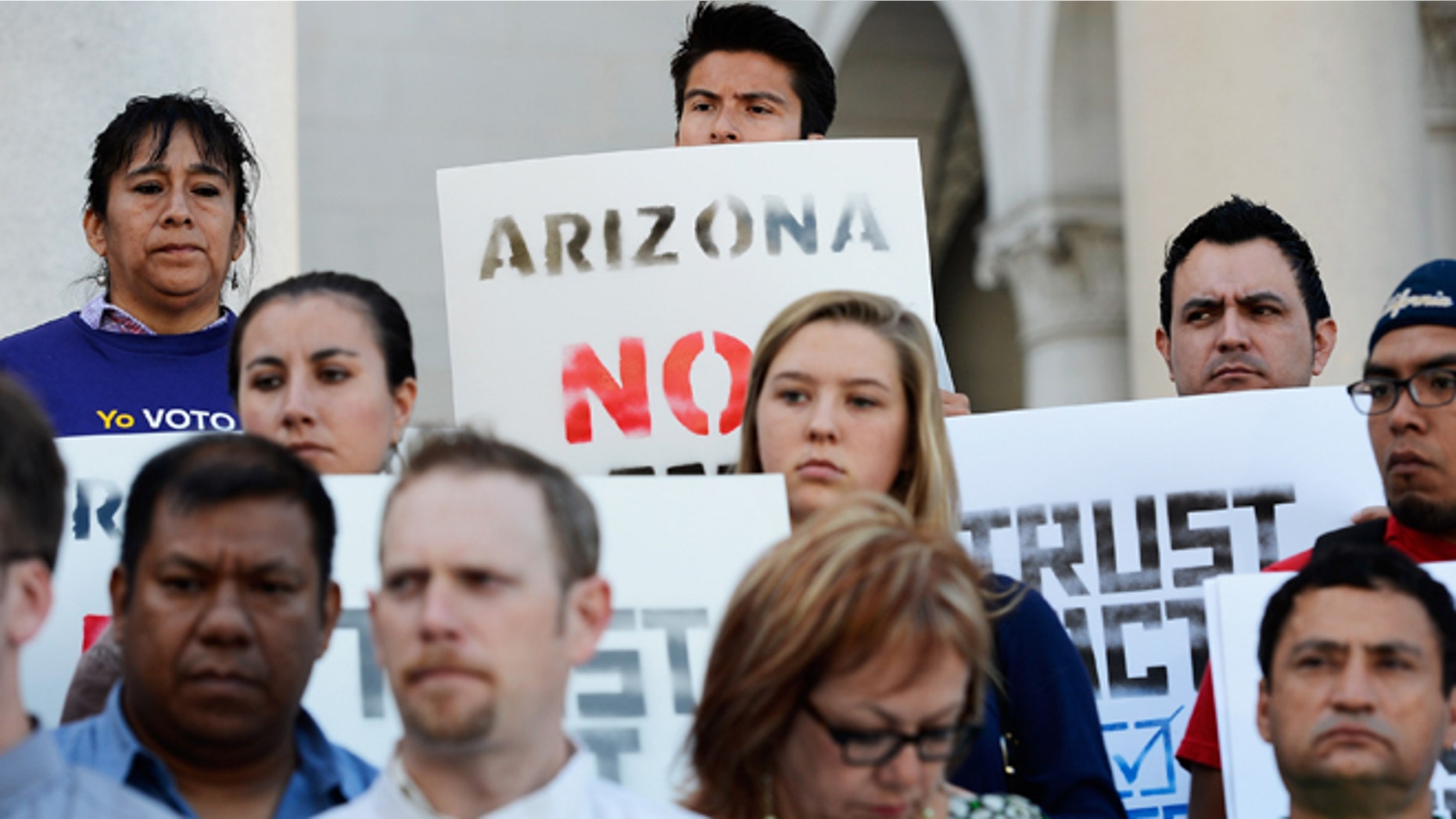 Activists and community leaders attend a rally and a news conference by the Coalition for Humane Immigrant Rights of Los Angeles regarding the U.S. Supreme Court's decision on the Arizona immigration law at Los Angeles City Hall on June 26, 2012 in Los Angeles, California. Getty Images