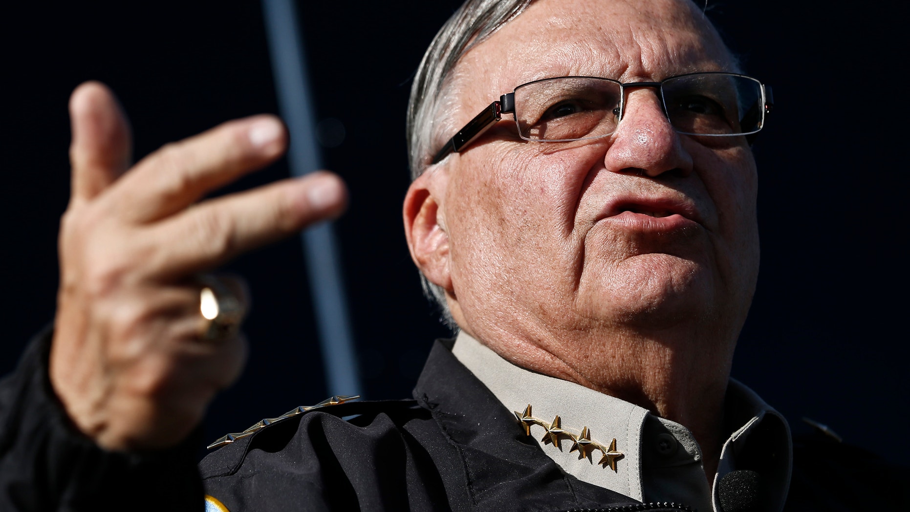 FILE - In this Jan. 9, 2013 file photo, Maricopa County Sheriff Joe Arpaio speaks with the media in Phoenix. Arpaio begins a four-day hearing Tuesday, April 21, that could bring him fines, damage his credibility and make him politically vulnerable for his acknowledged violations of a judge's orders in a racial profiling case. (AP Photo/Ross D. Franklin,File)