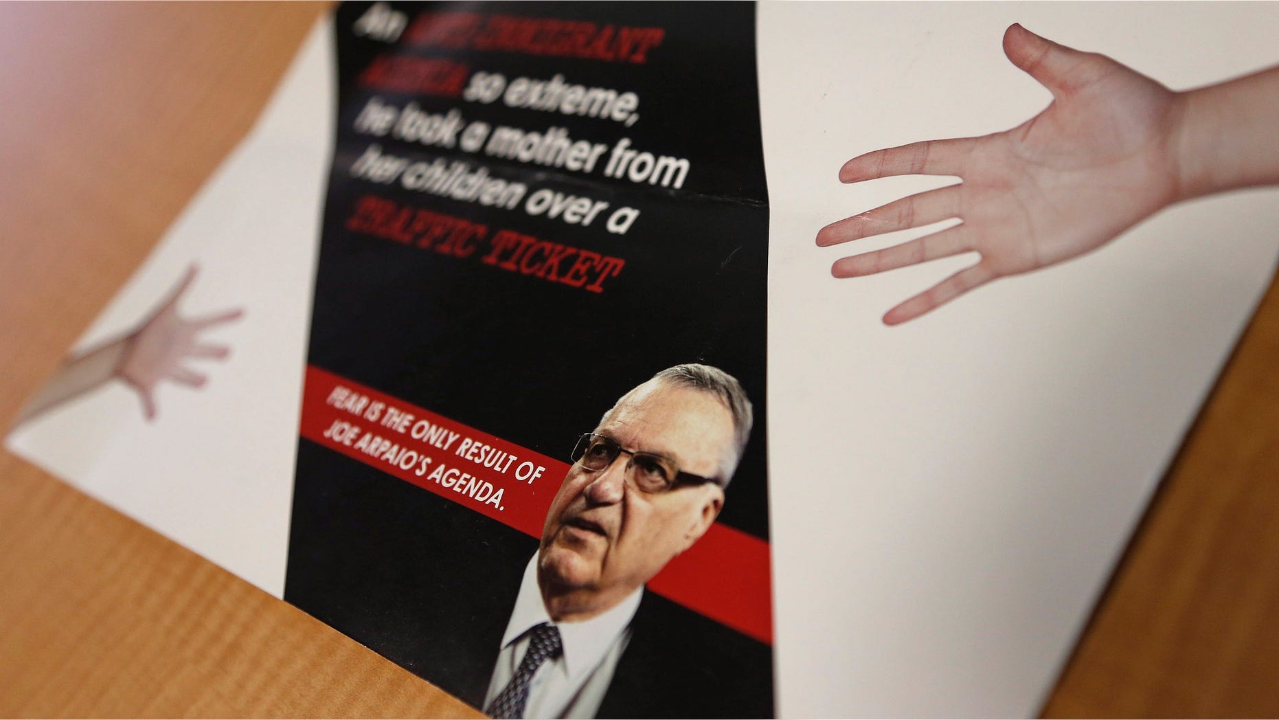 FILE - In this Sept. 13, 2016, file photo, a group backed by the New York hedge fund billionaire George Soros, a longtime bankroller of liberal political causes, is mailing anti-Joe Arpaio fliers to Phoenix-area voters. Paul Penzone, a former Phoenix police sergeant running against Arpaio, is getting a boost from the unlikely Soros source. The sheriff of metro Phoenix has won re-election by crafting an image as a law enforcer who targeted parents who skip out on child support, abusers of animals and immigrants who are in the country illegally. Now, Sheriff Joe Arpaio is the one being targeted in a criminal case after he was charged two weeks before Election Day with contempt-of-court for defying a judge's order in a racial profiling case. (AP Photo/Ross D. Franklin, File)