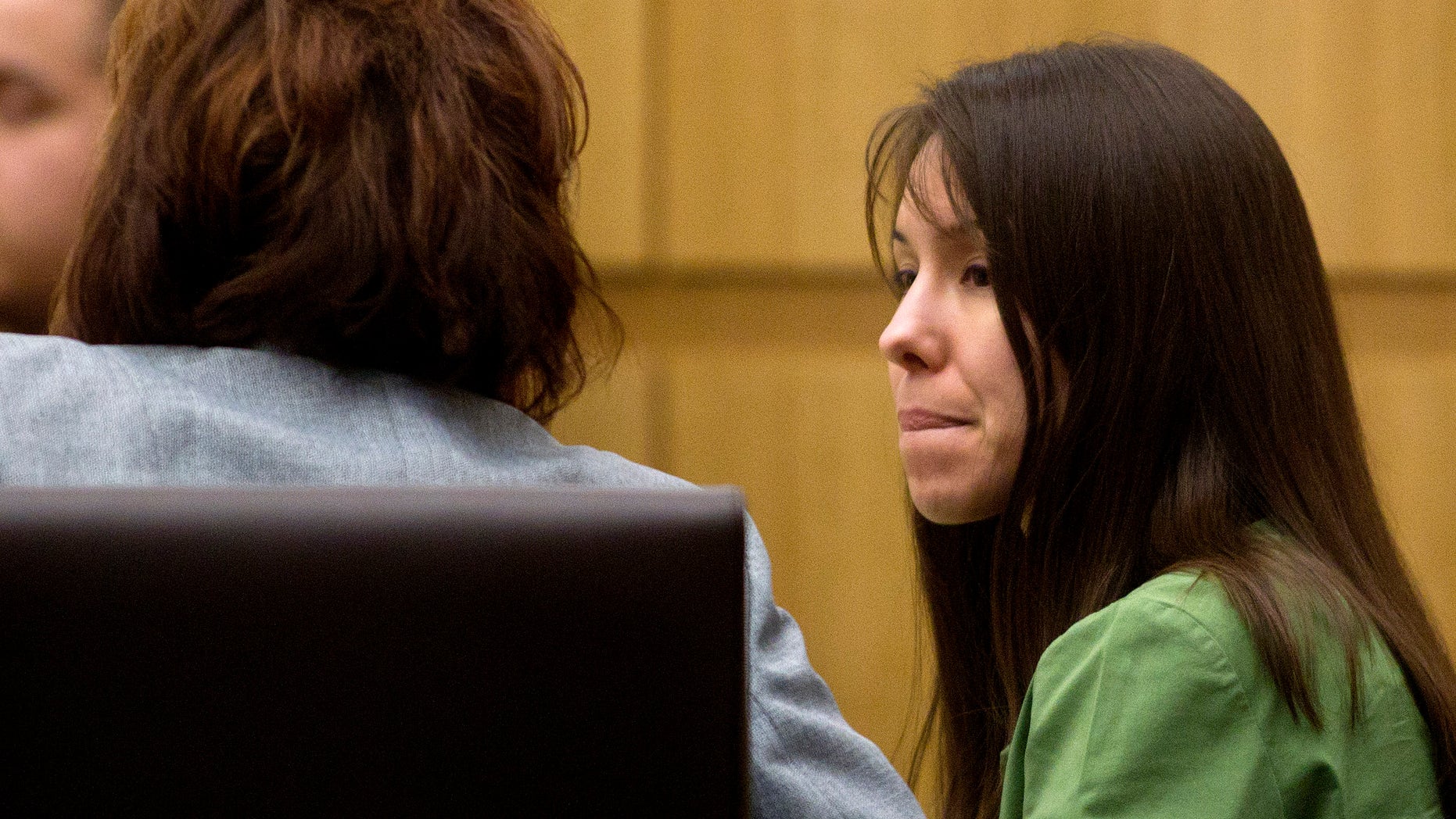 Jan 3, 2012: Defendant Jodi Arias talks with her defense team during her trial at Maricopa County Court in Phoenix.