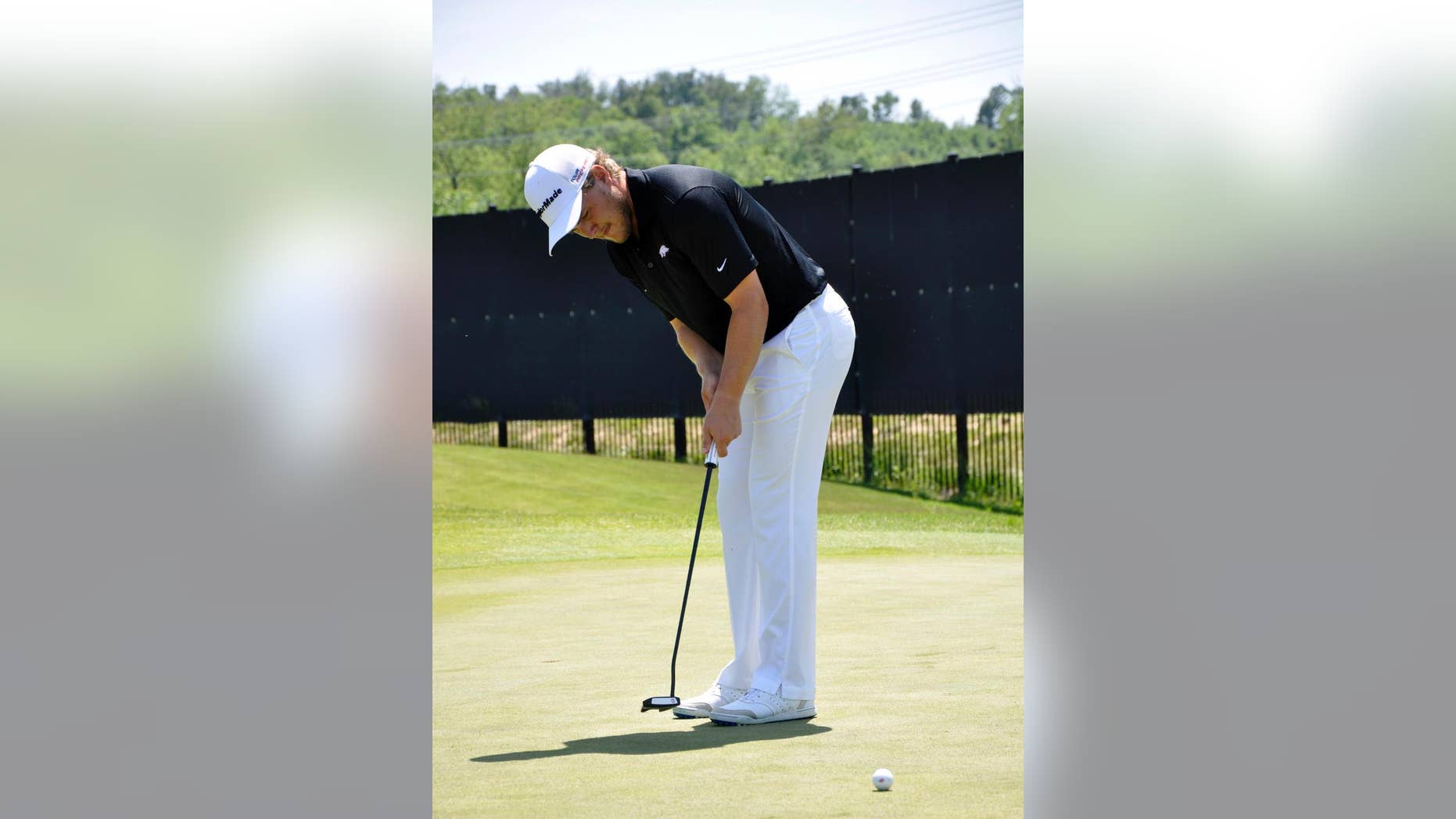 In this photo taken May 20, 2014, Arkansas golfer Sebastian Cappelen practices his putting at the team’s practice facility at the Blessings Golf Course in Johnson, Ark. The senior is a three-time All-American for the Razorbacks, and hopes to end his career with a win at this weekend’s NCAA golf championship in Hutchinson, Kansas. (AP Photos/Kurt Voigt)