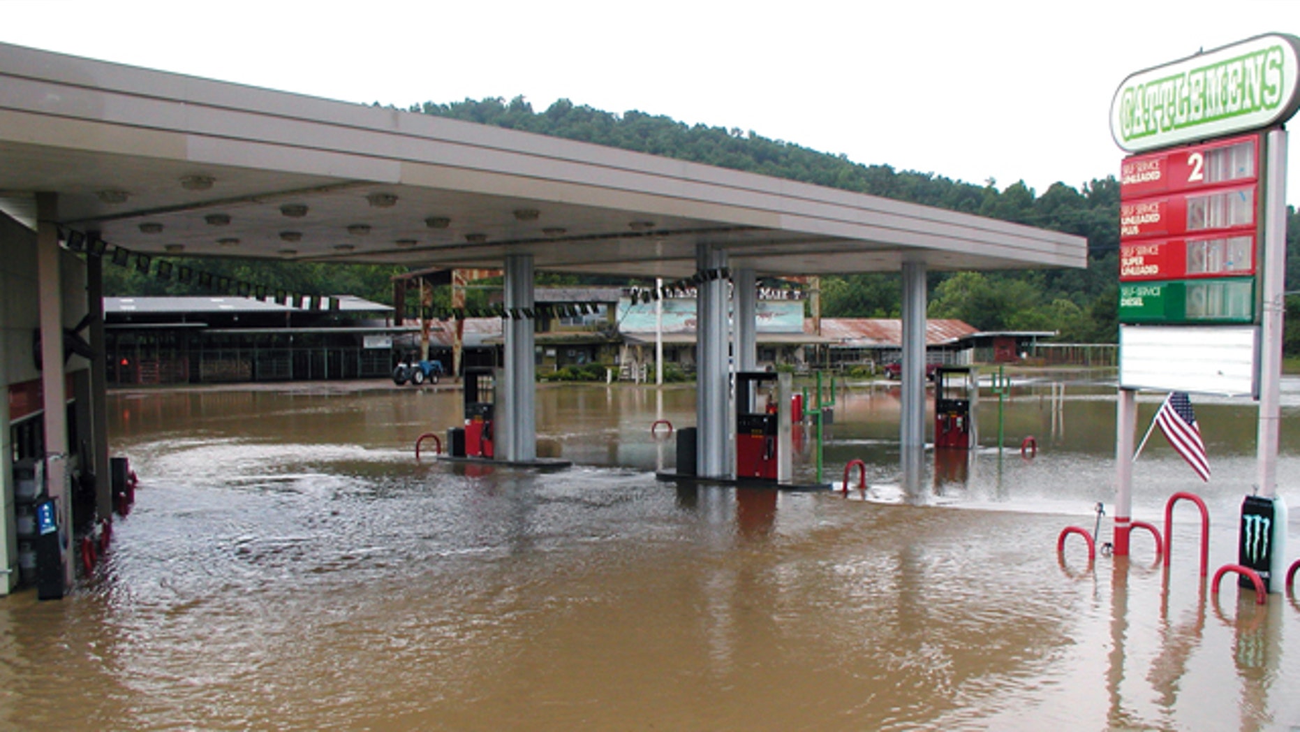 June 11, 2010: A convenience store is flooded by the Caddo River in Glenwood, Ark., part of deadly flash floods that swamped nearby campgrounds.